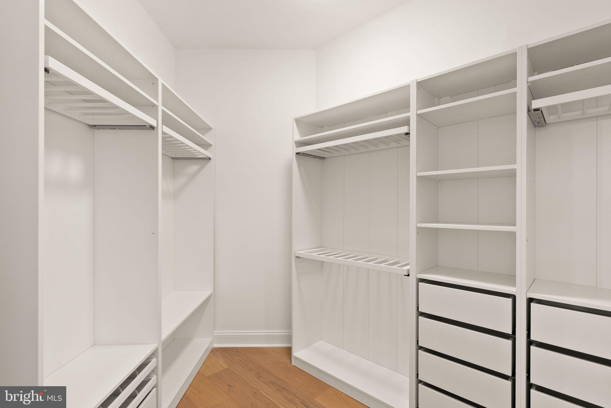 3336 Jones Bridge Court Chevy Chase, MD 20815 - Photo 53 of 99 a view of walk in closet with empty racks