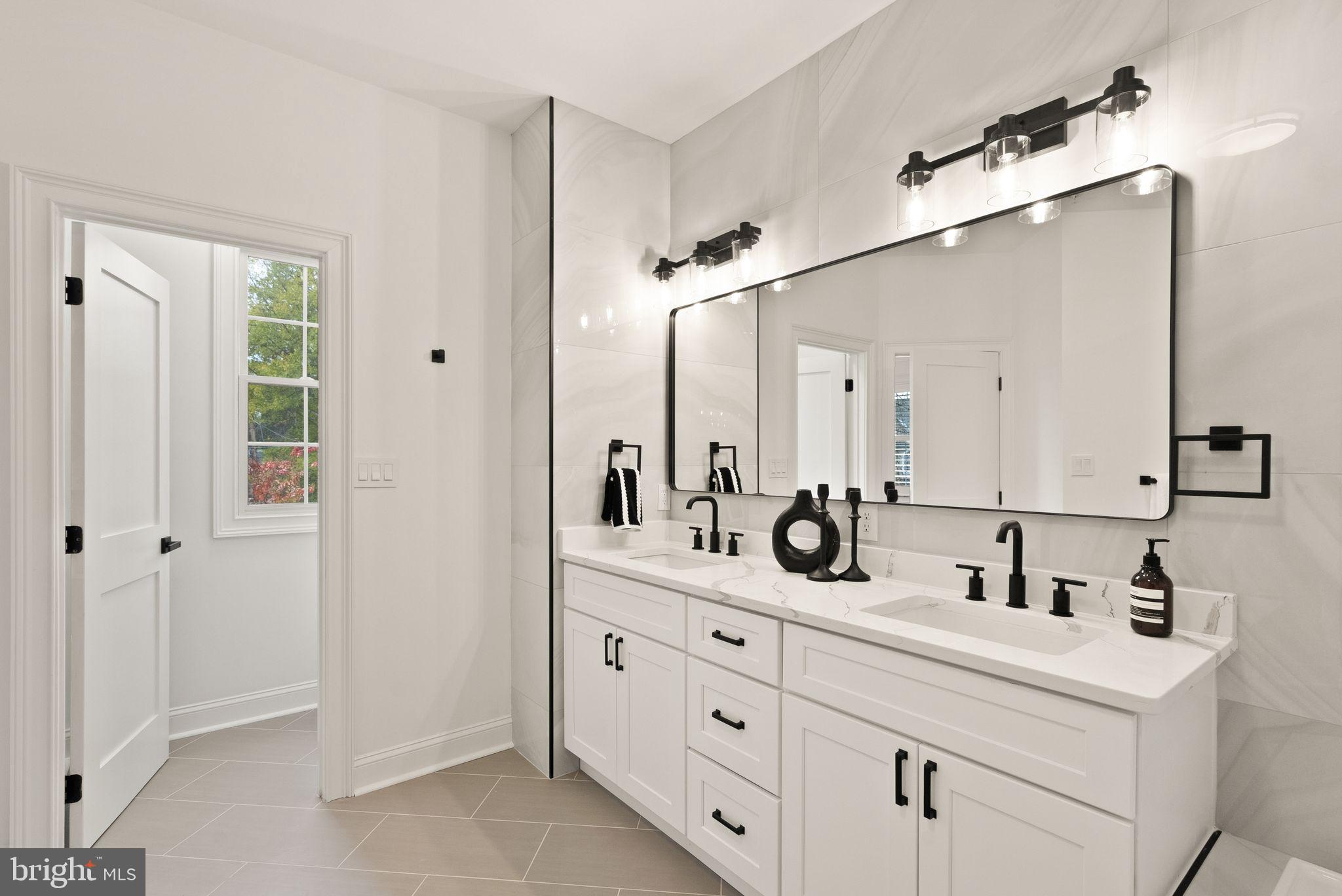 3336 Jones Bridge Court Chevy Chase, MD 20815 - Photo 58 of 99 a bathroom with a double vanity sink mirror and