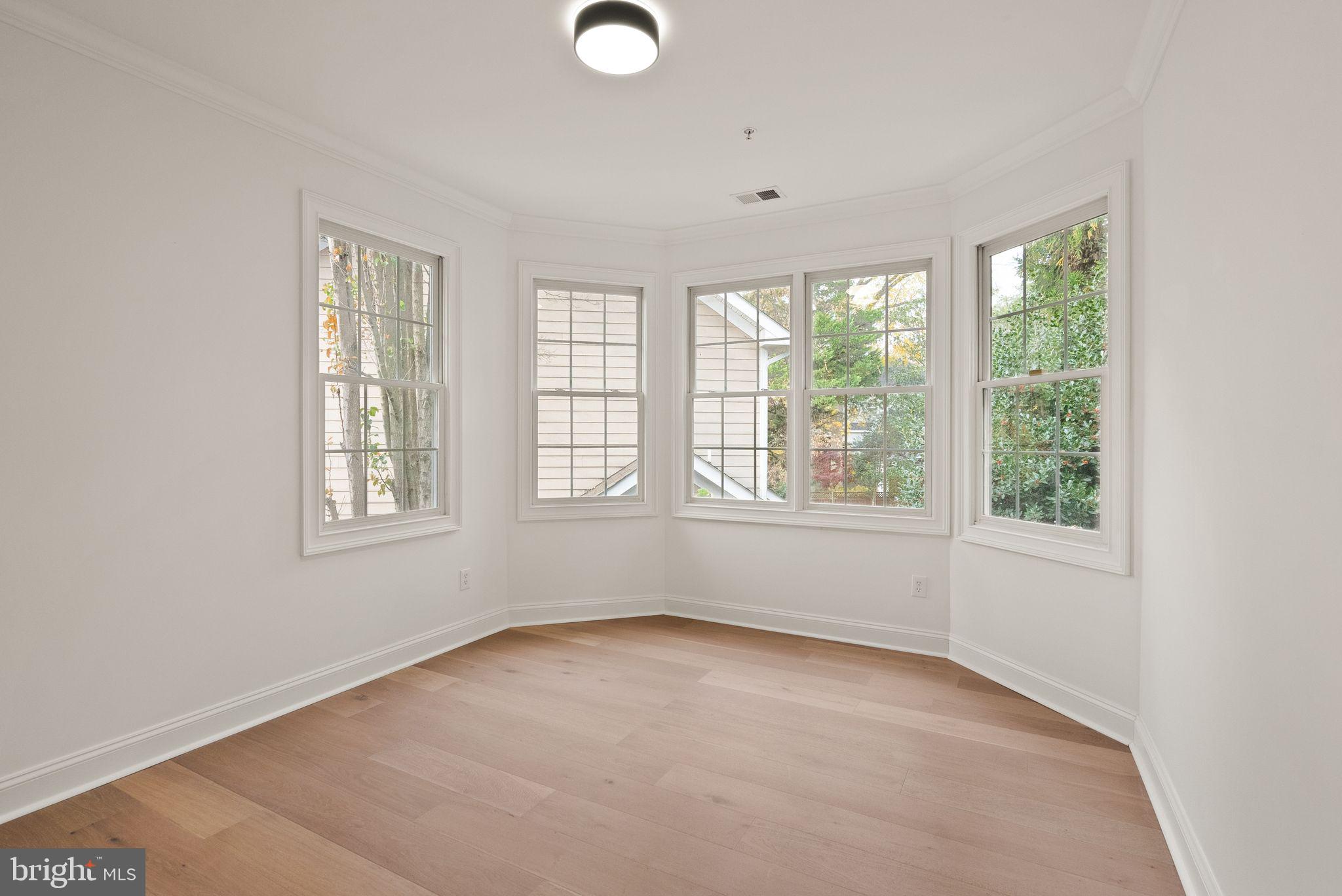 3336 Jones Bridge Court Chevy Chase, MD 20815 - Photo 62 of 99 an empty room with windows