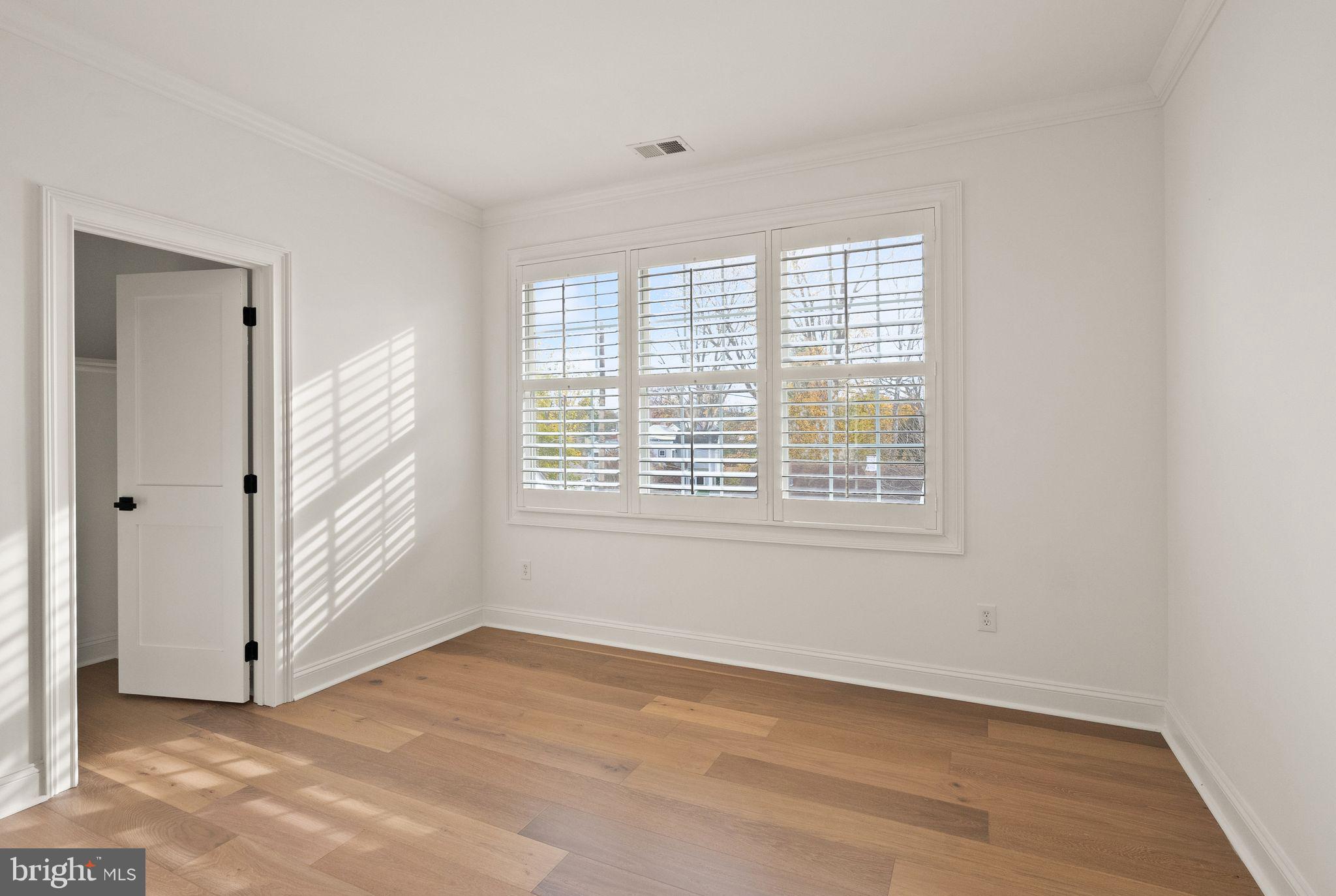 3336 Jones Bridge Court Chevy Chase, MD 20815 - Photo 68 of 99 a view of an empty room with a window