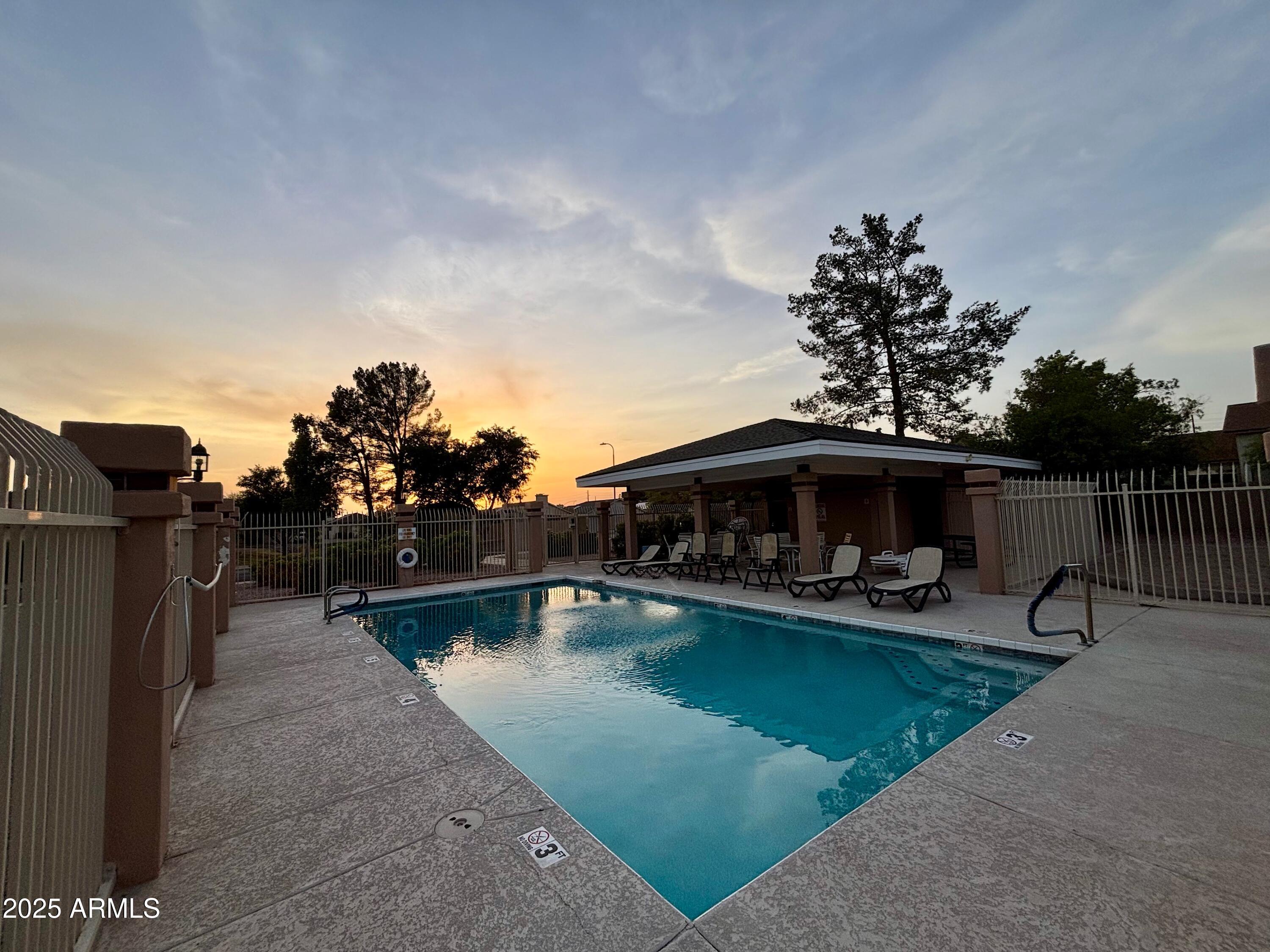 4725 East Brown Road, Unit 57 Mesa, AZ 85205 - Photo 13 of 14 a view of a swimming pool with chairs