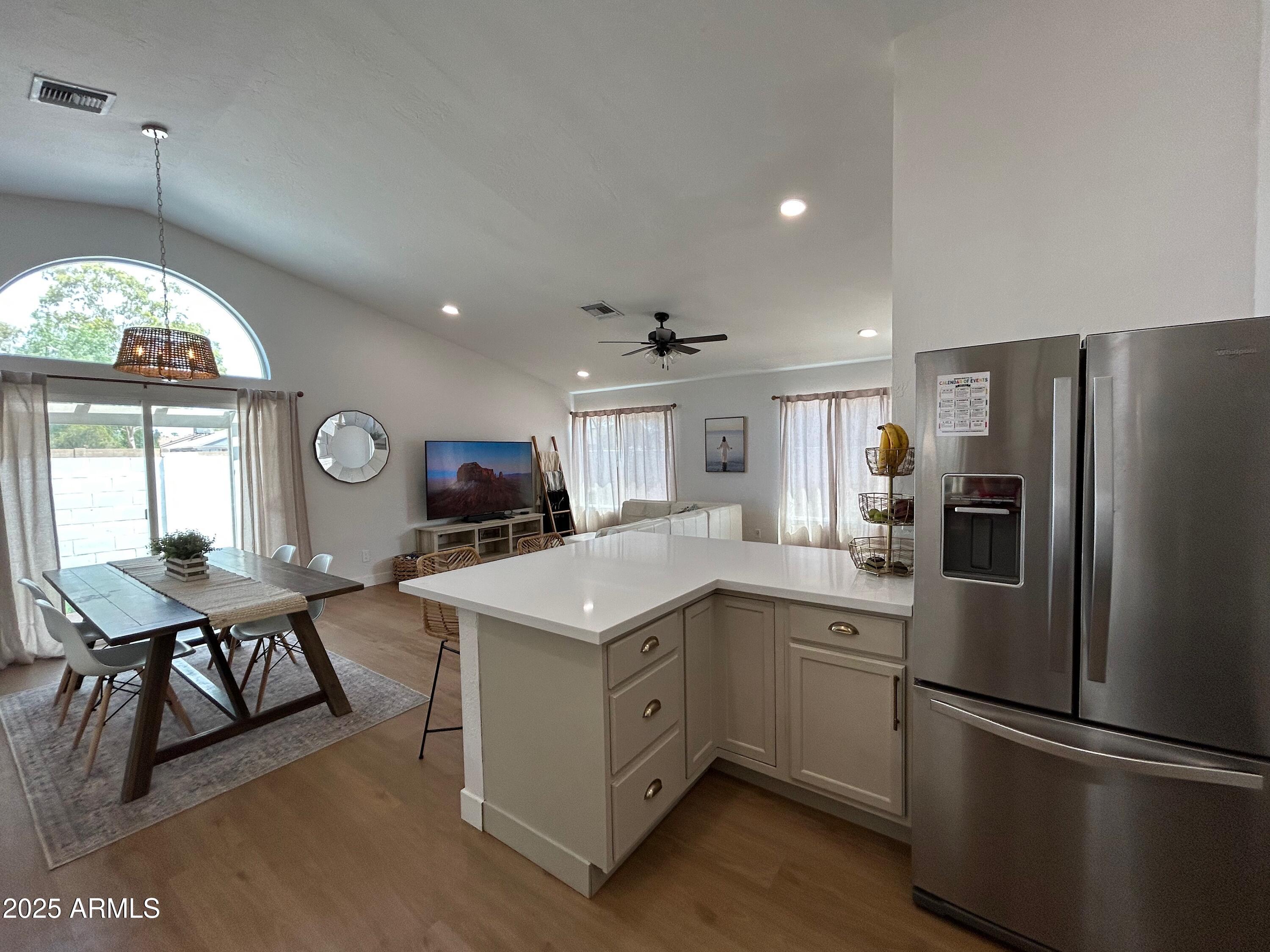4725 East Brown Road, Unit 57 Mesa, AZ 85205 - Photo 3 of 14 a kitchen with sink cabinets and outdoor view