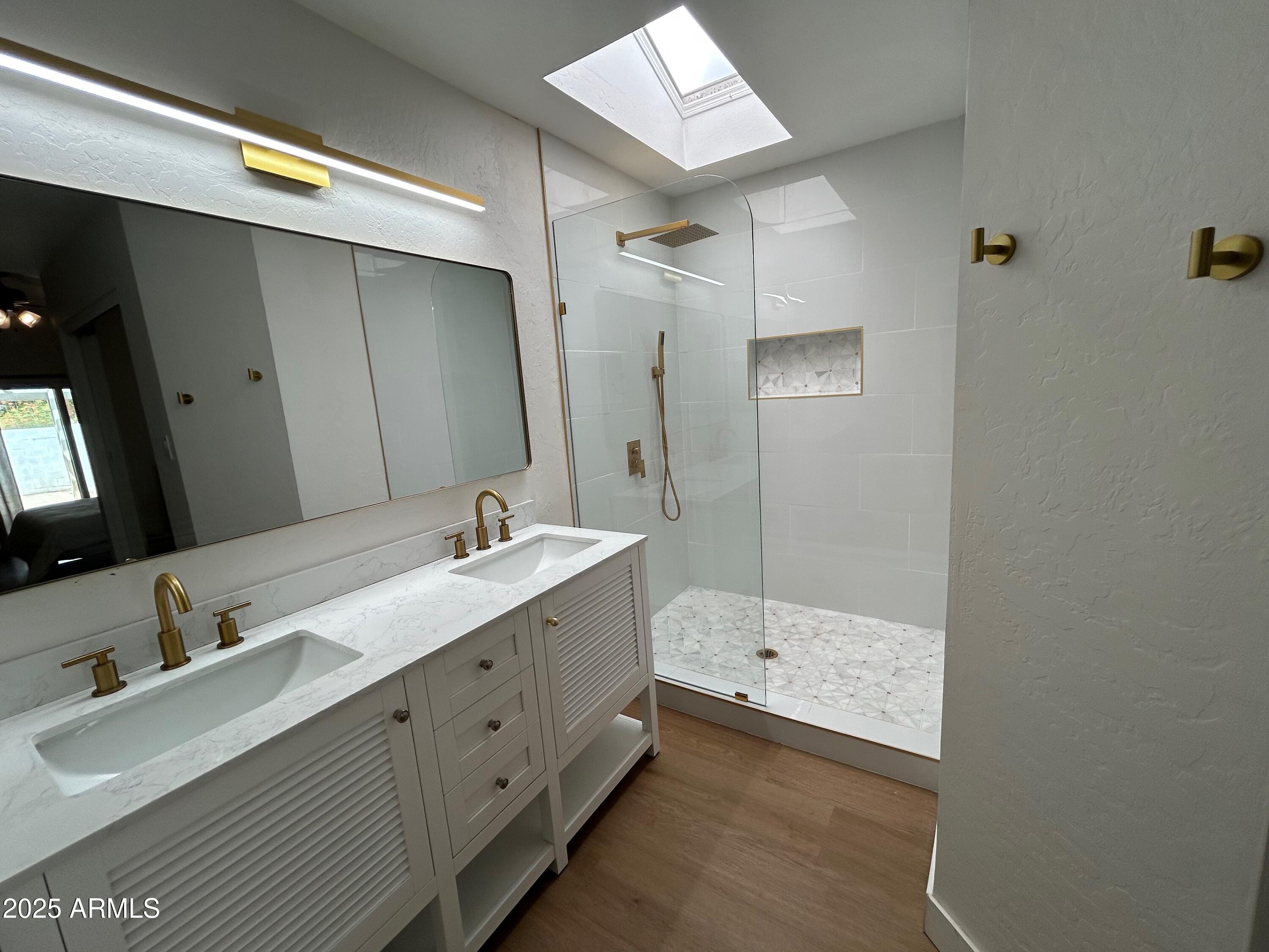 4725 East Brown Road, Unit 57 Mesa, AZ 85205 - Photo 7 of 14 a bathroom with a double vanity sink and mirror with shower