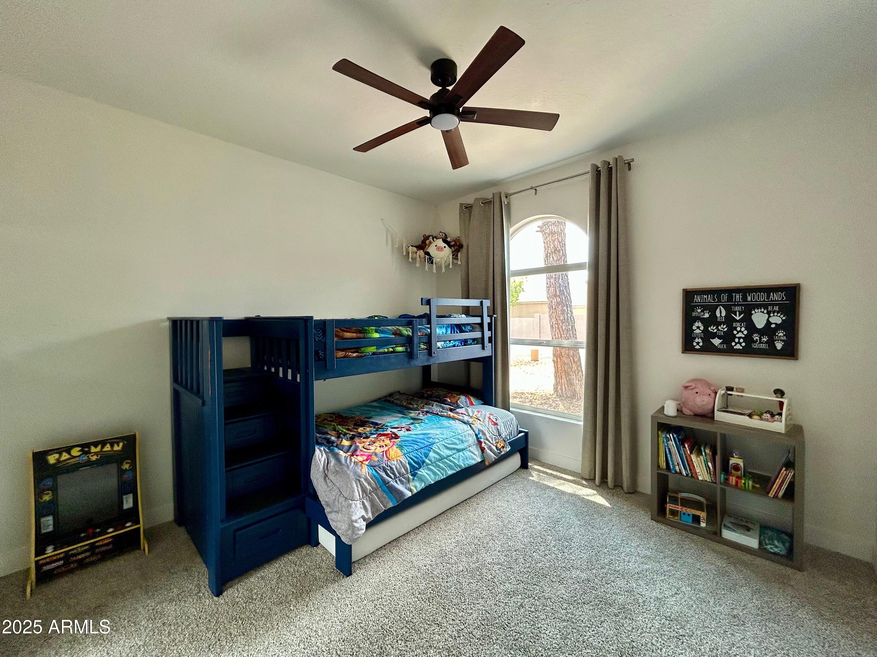 4725 East Brown Road, Unit 57 Mesa, AZ 85205 - Photo 8 of 14 a bedroom with furniture and a window