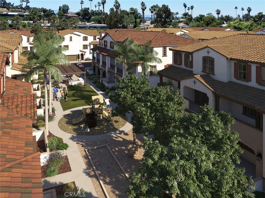 4877 Merida Way Oceanside, CA 92057 - Photo 4 of 9 an aerial view of a house with a yard and lake view