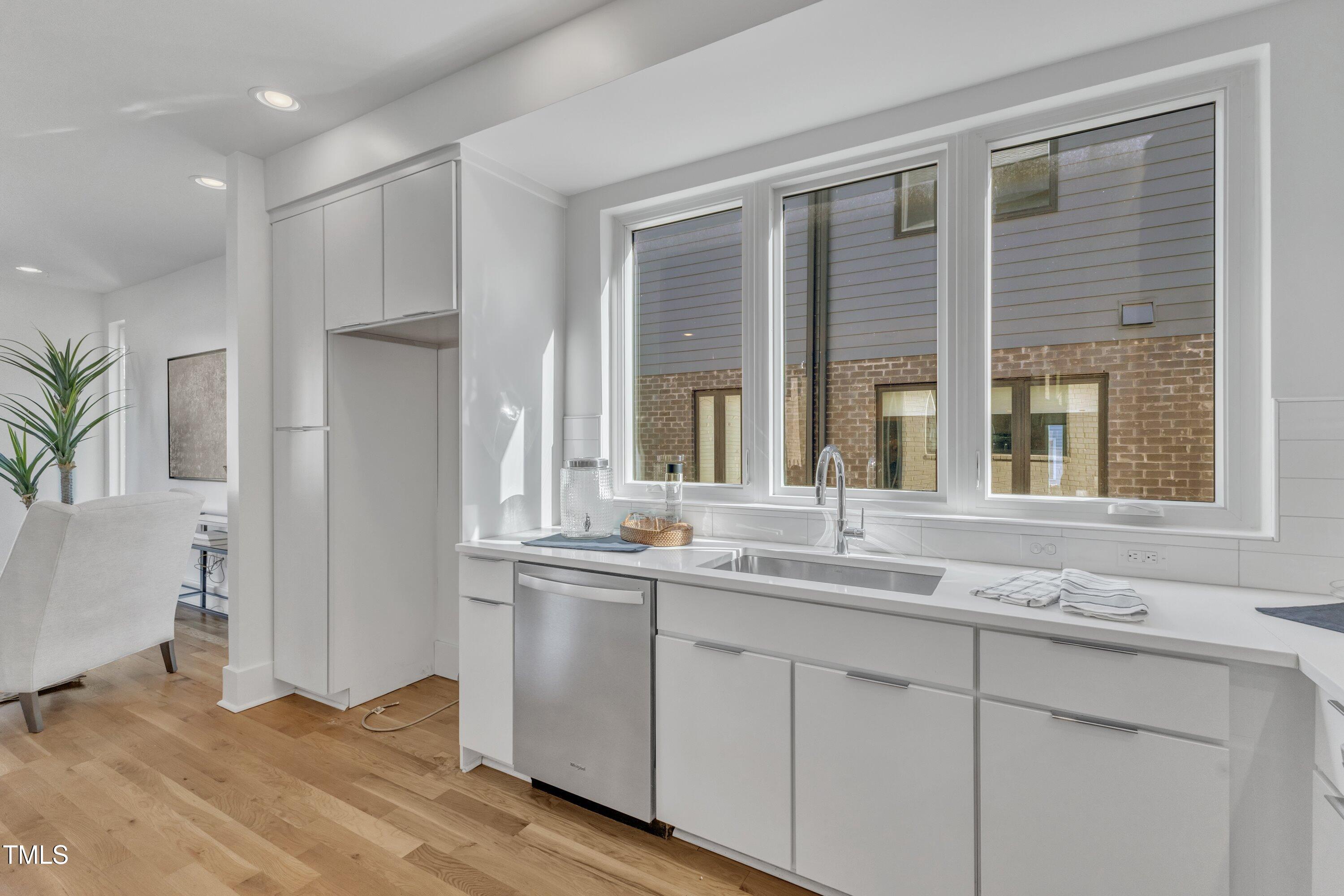 524 East Edenton Street Raleigh, NC 27601 - Photo 17 of 70 a bathroom with a sink and a window