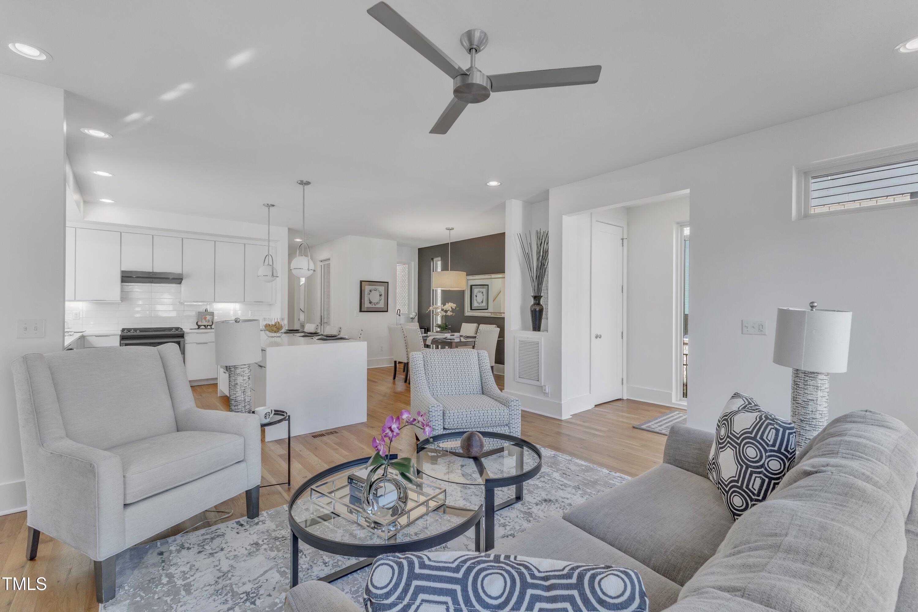 524 East Edenton Street Raleigh, NC 27601 - Photo 19 of 70 a living room with furniture kitchen view and a table