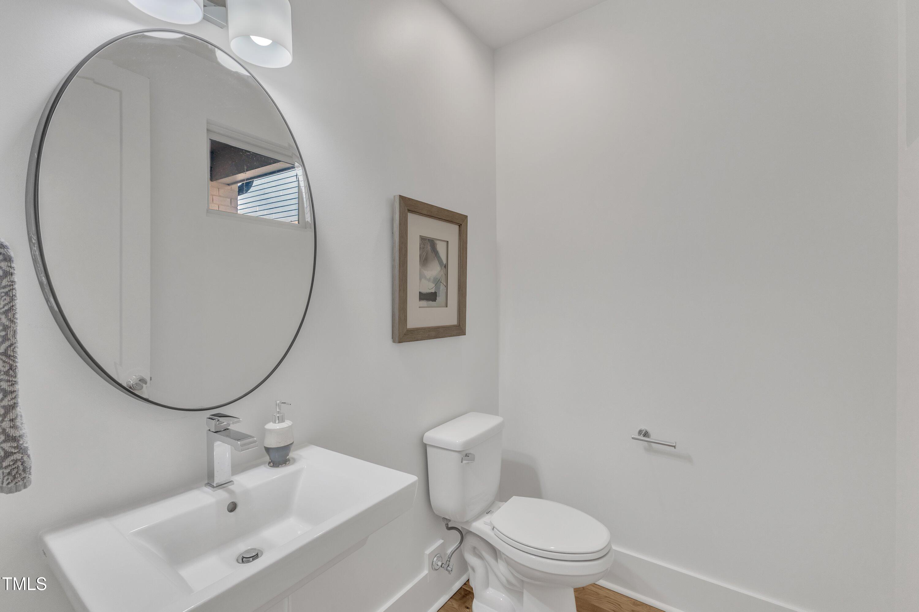 524 East Edenton Street Raleigh, NC 27601 - Photo 26 of 70 a bathroom with a sink and a mirror