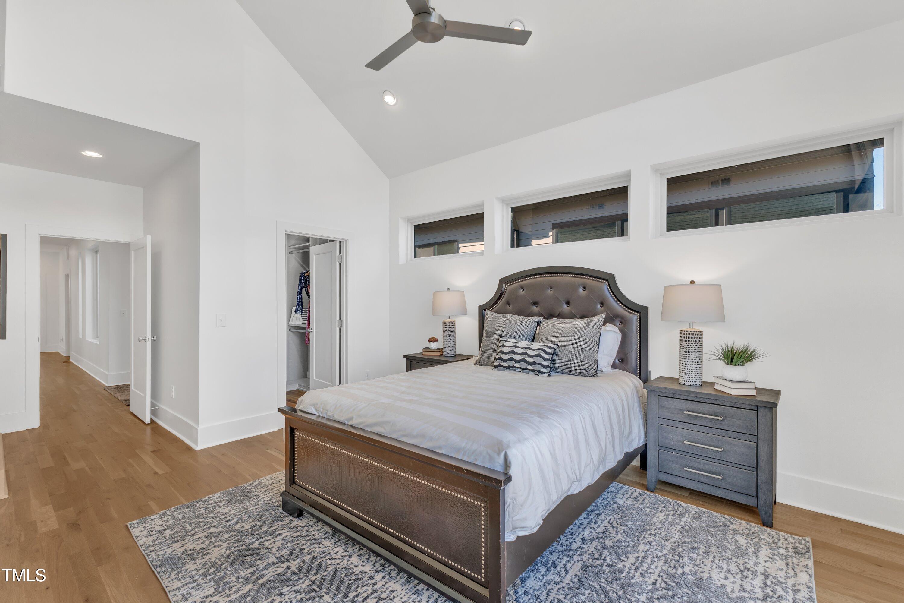 524 East Edenton Street Raleigh, NC 27601 - Photo 30 of 70 a bedroom with a bed and wooden floor