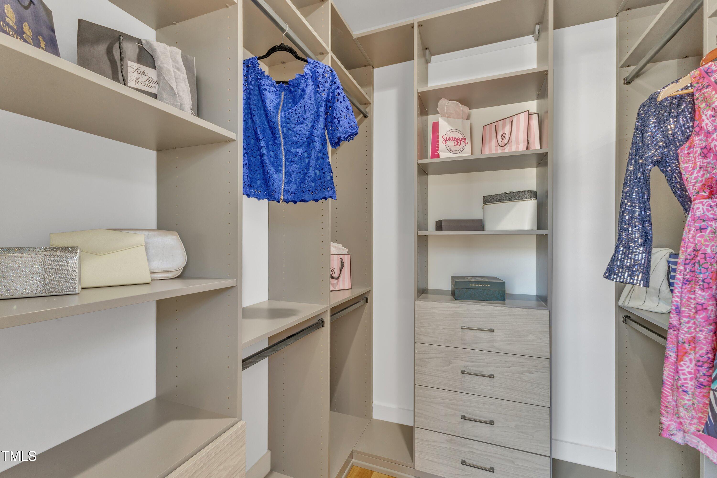 524 East Edenton Street Raleigh, NC 27601 - Photo 33 of 70 a view of walk in closet with clothes and shoes