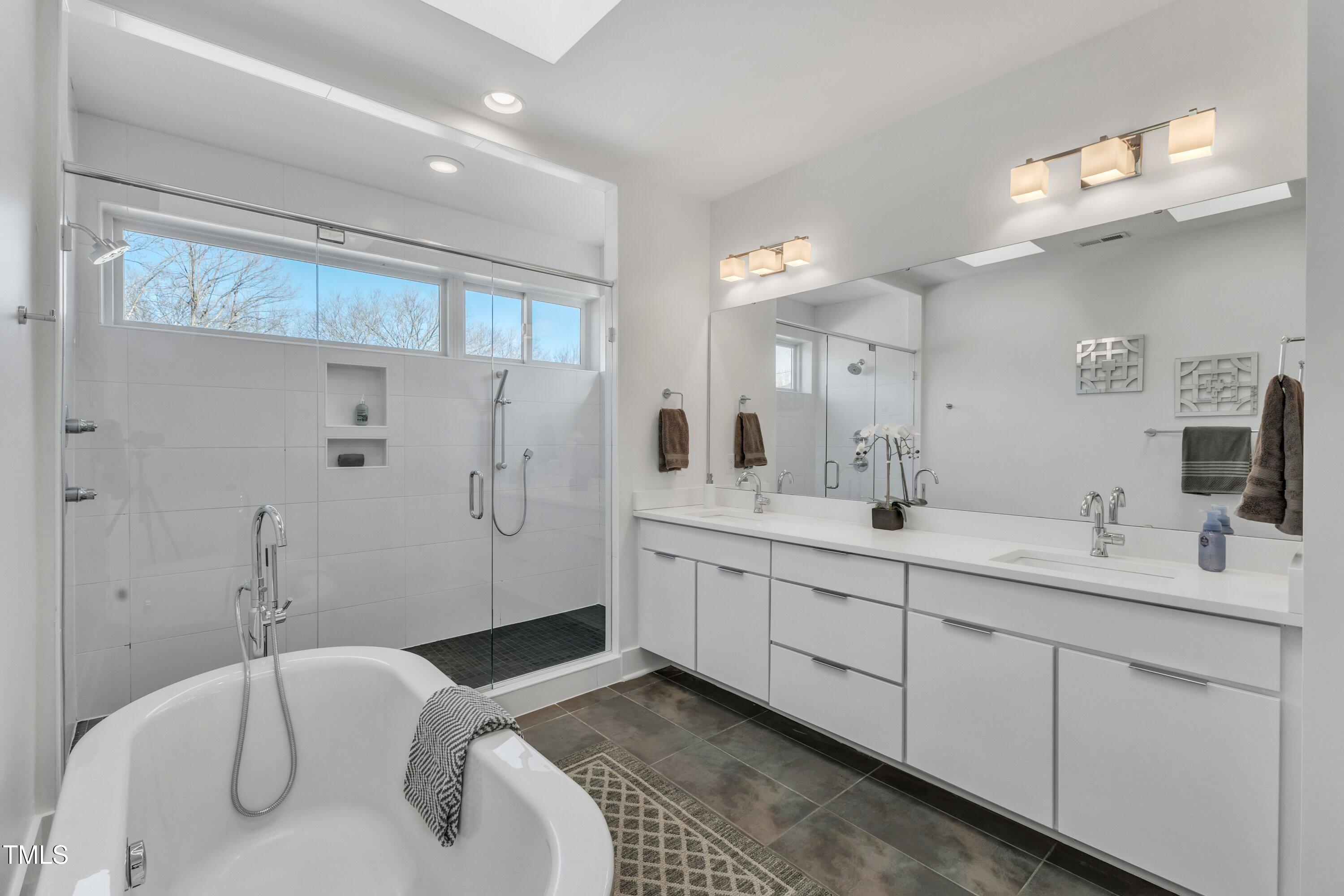 524 East Edenton Street Raleigh, NC 27601 - Photo 34 of 70 a spacious bathroom with a double vanity sink mirror and shower