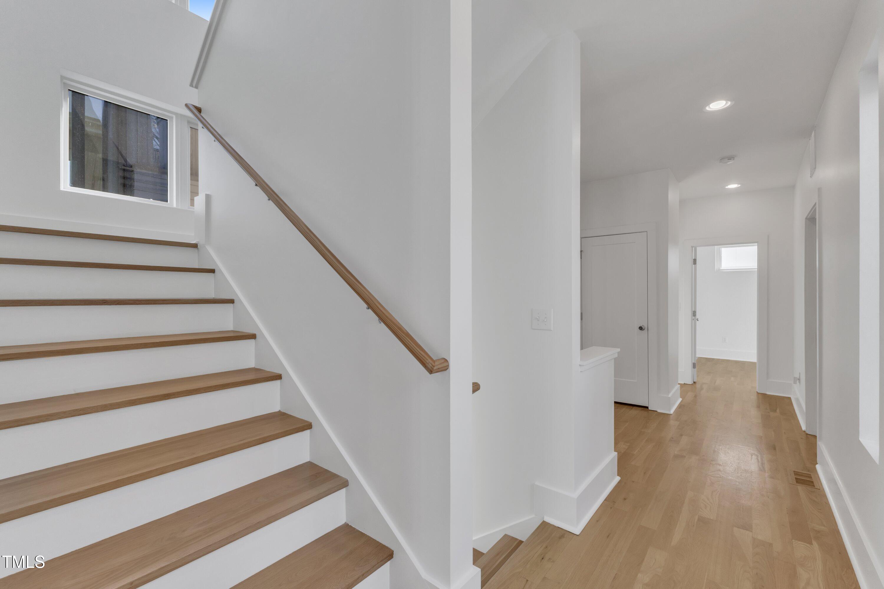 524 East Edenton Street Raleigh, NC 27601 - Photo 42 of 70 a view of entryway with wooden floor and stairs