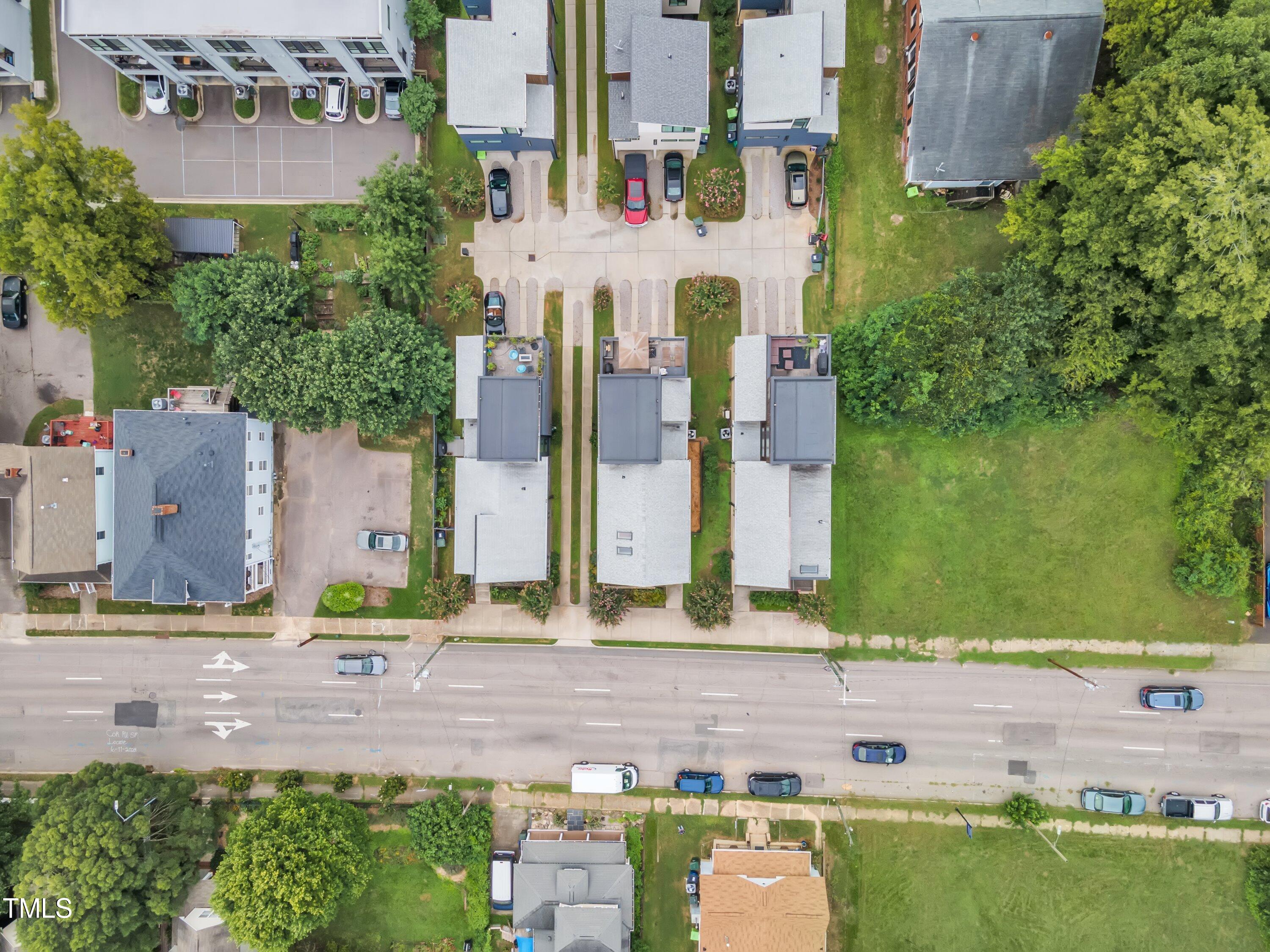 524 East Edenton Street Raleigh, NC 27601 - Photo 64 of 70 an aerial view of residential houses with outdoor space and parking