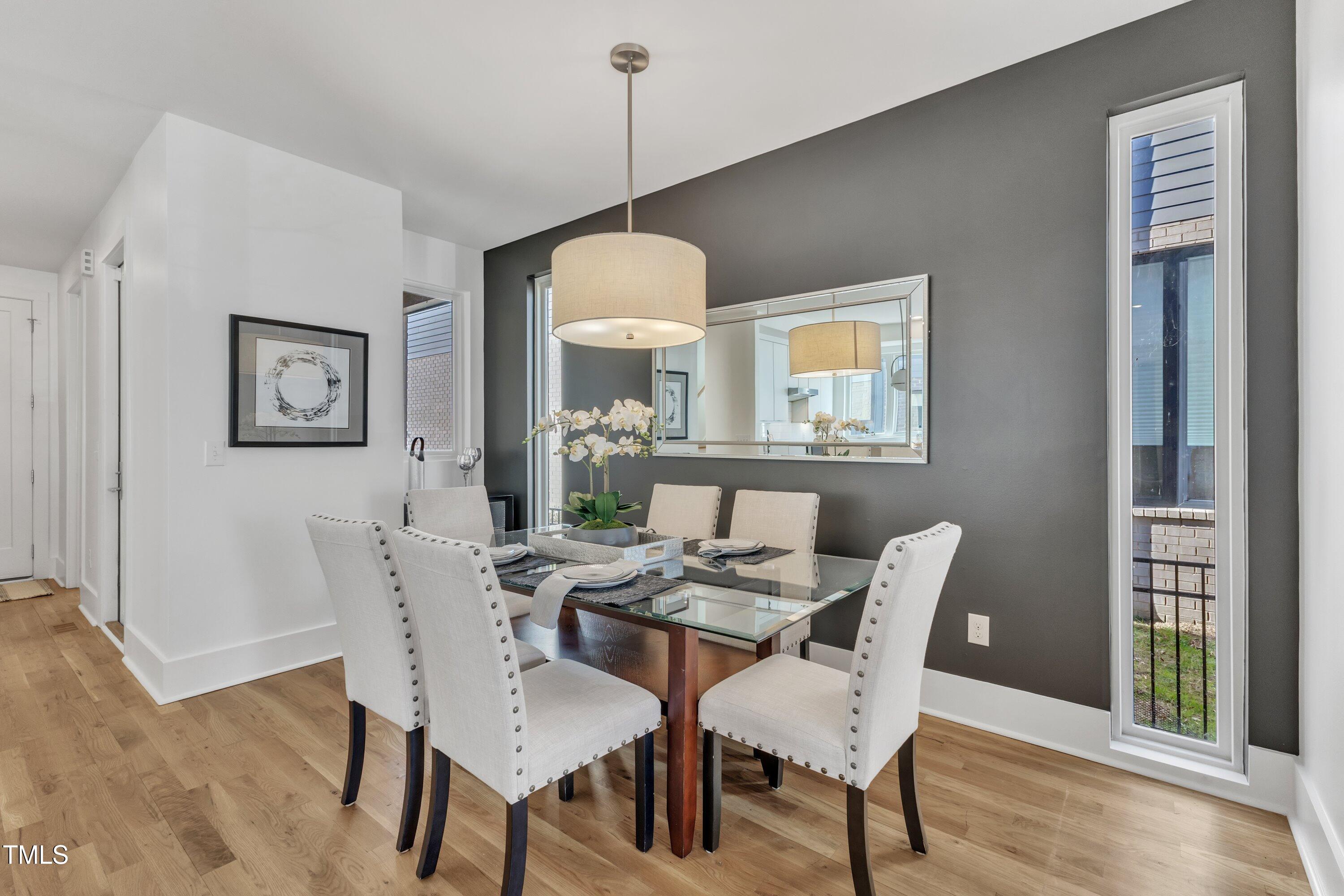 524 East Edenton Street Raleigh, NC 27601 - Photo 10 of 70 a dining room with furniture a chandelier and wooden floor