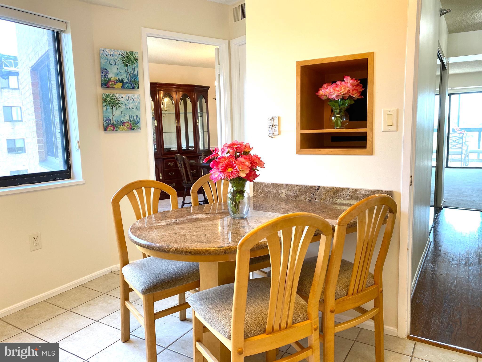 15115 Interlachen Drive, Unit 3812 Silver Spring, MD 20906 - Photo 20 of 39 Custom built Granite table matching the counters