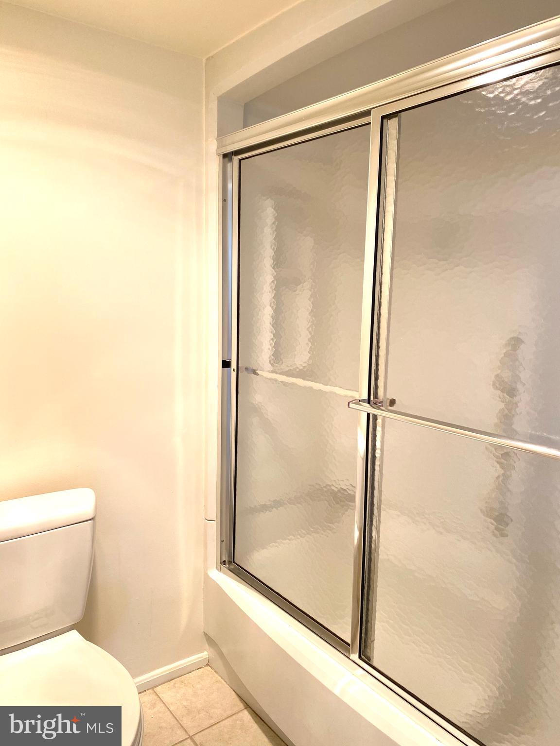 15115 Interlachen Drive, Unit 3812 Silver Spring, MD 20906 - Photo 28 of 39 Tub and shower in the primary bathroom