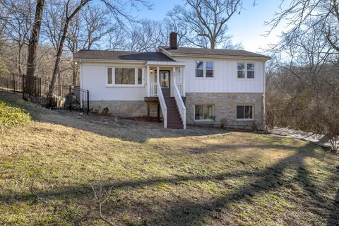 a bed room with a bed and a window