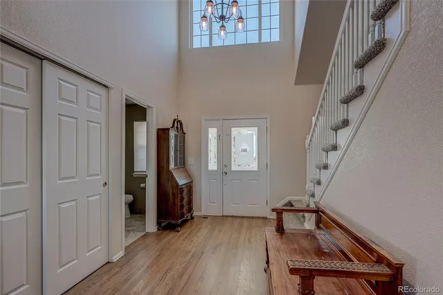 a view of a livingroom with furniture and hardwood floor