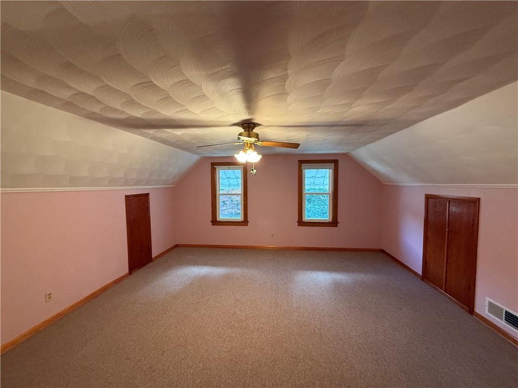 3948 Piney Dam Road Clarion, PA 16214 - Photo 11 of 23 an empty room with windows and ceiling fan