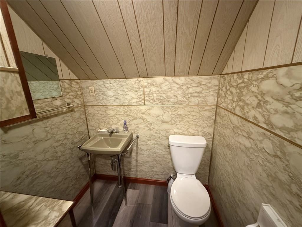 3948 Piney Dam Road Clarion, PA 16214 - Photo 13 of 23 a bathroom with a toilet a sink and a mirror