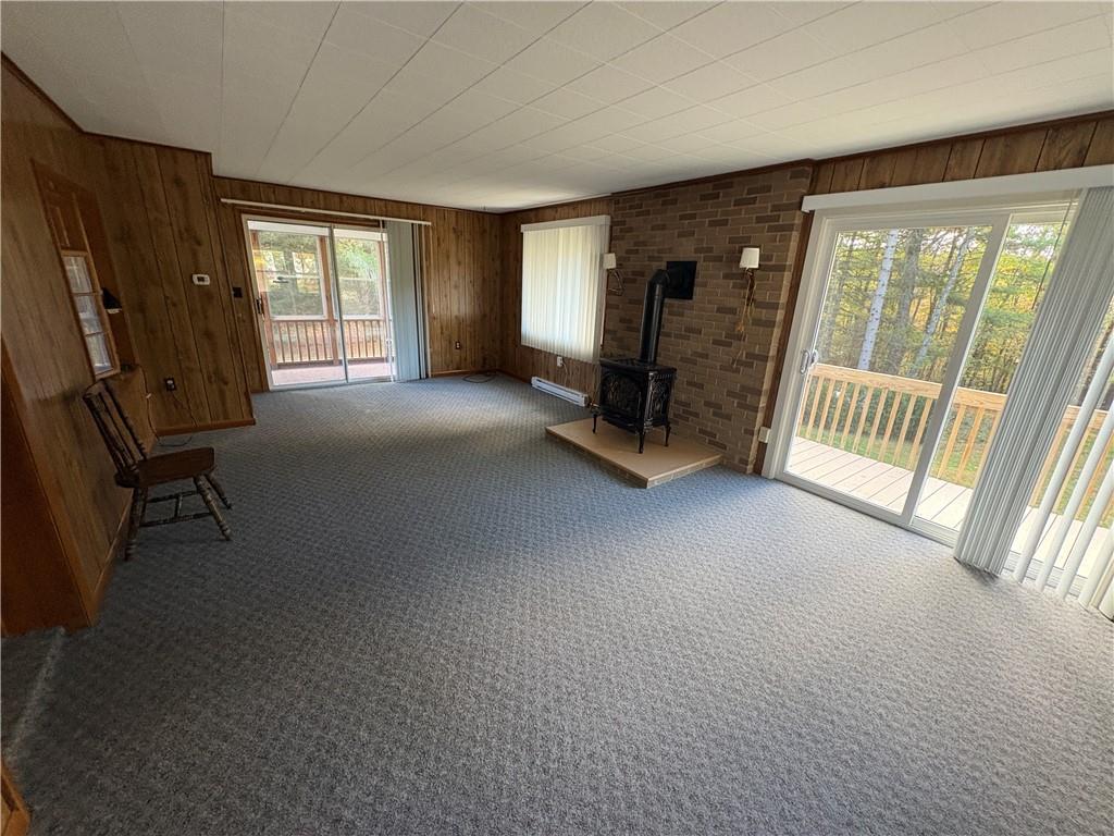 3948 Piney Dam Road Clarion, PA 16214 - Photo 14 of 23 a view of an empty room with a fireplace and a window
