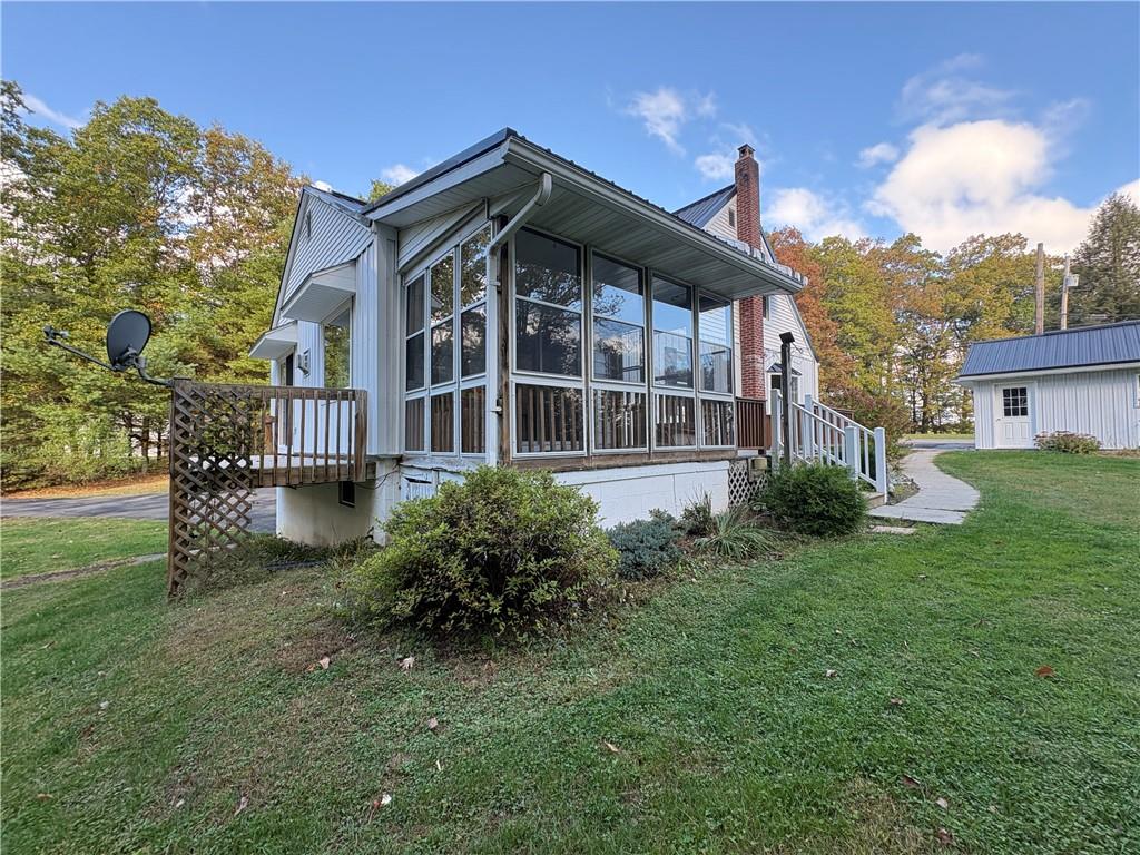 3948 Piney Dam Road Clarion, PA 16214 - Photo 15 of 23 a front view of a house with a garden