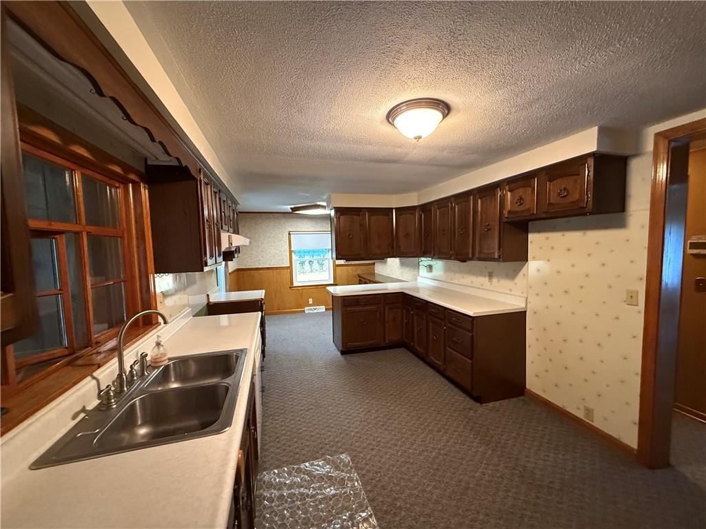 3948 Piney Dam Road Clarion, PA 16214 - Photo 7 of 23 a kitchen with a sink and cabinets