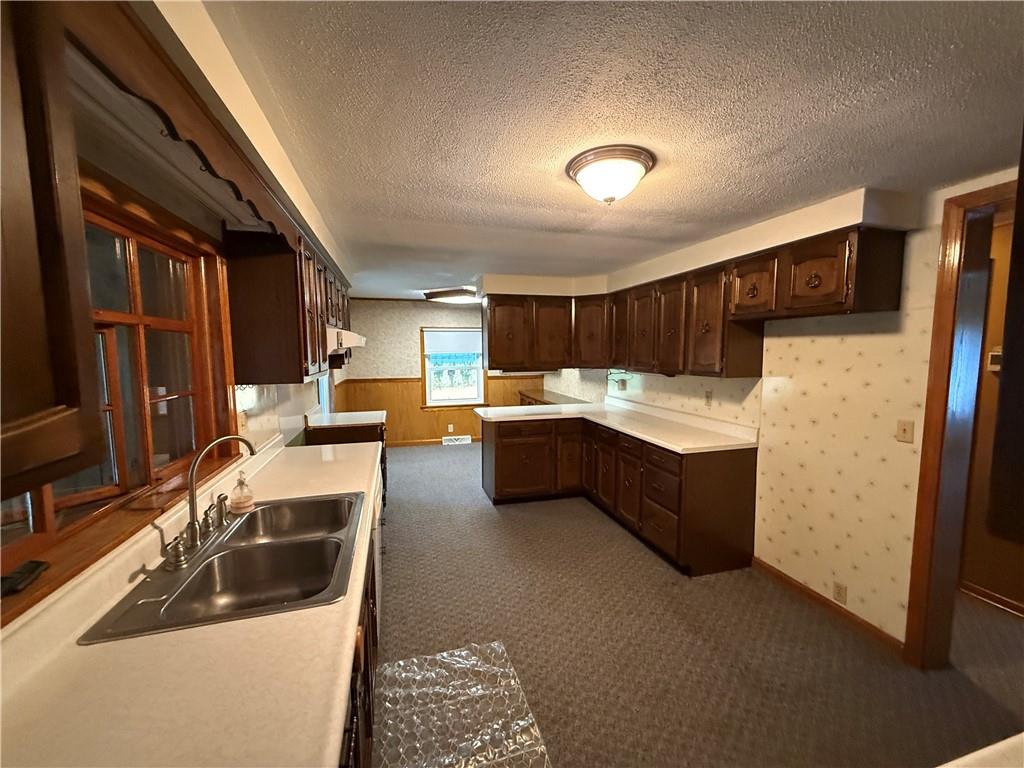 3948 Piney Dam Road Clarion, PA 16214 - Photo 8 of 23 a kitchen with a sink and a refrigerator