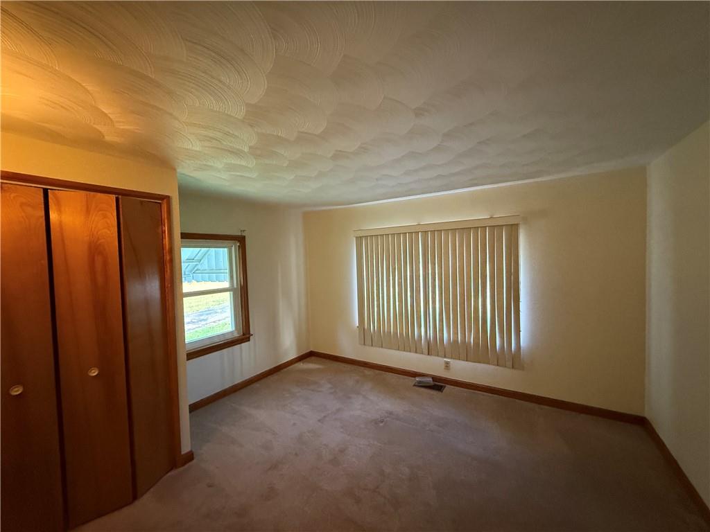 3948 Piney Dam Road Clarion, PA 16214 - Photo 9 of 23 a view of an empty room with a window