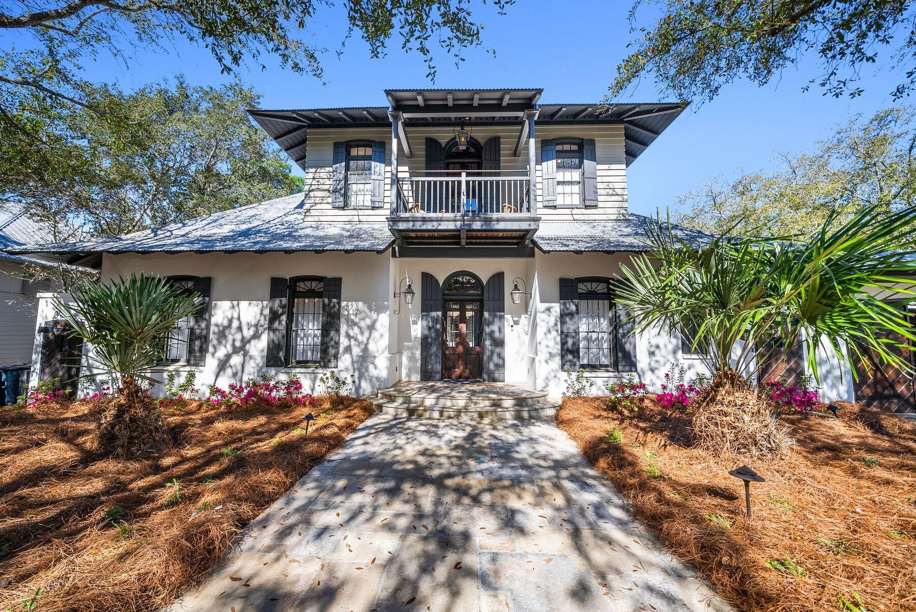 a front view of house with yard and outdoor seating