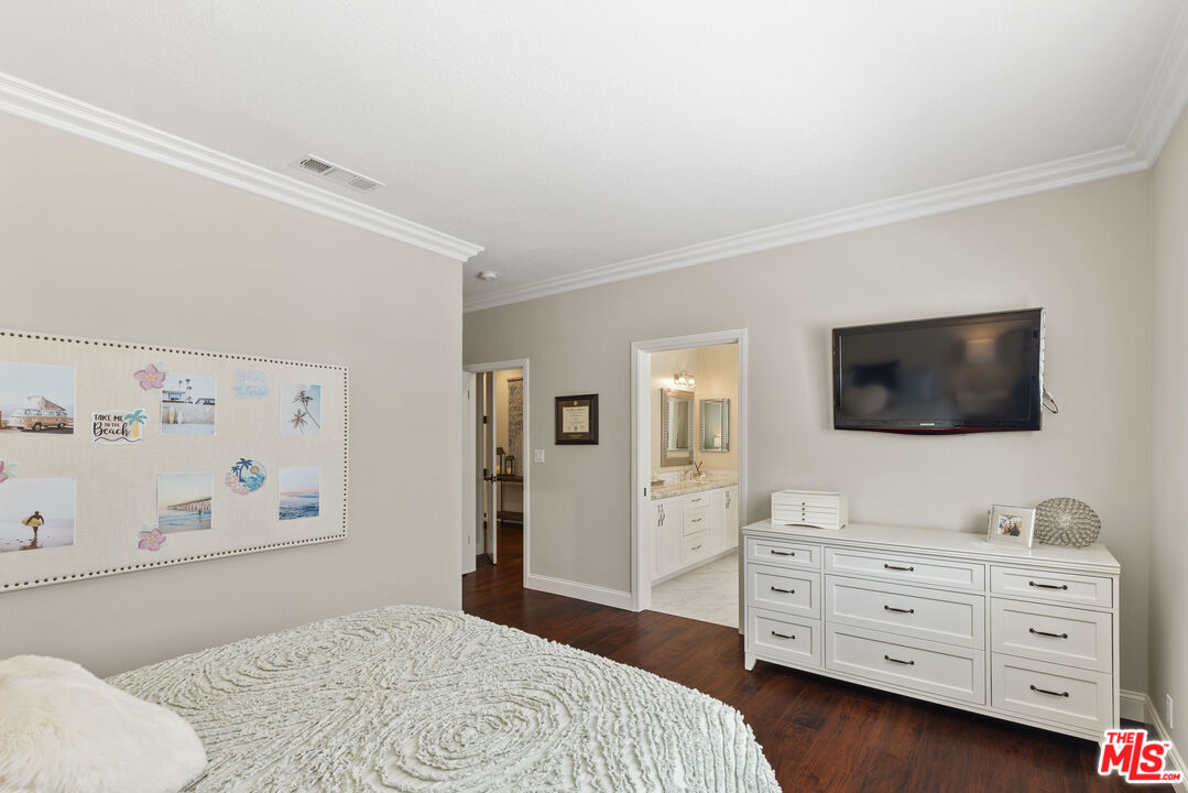 38 Inverness Road Thousand Oaks, CA 91361 - Photo 30 of 42 a bedroom with a bed and a flat screen tv in a dresser