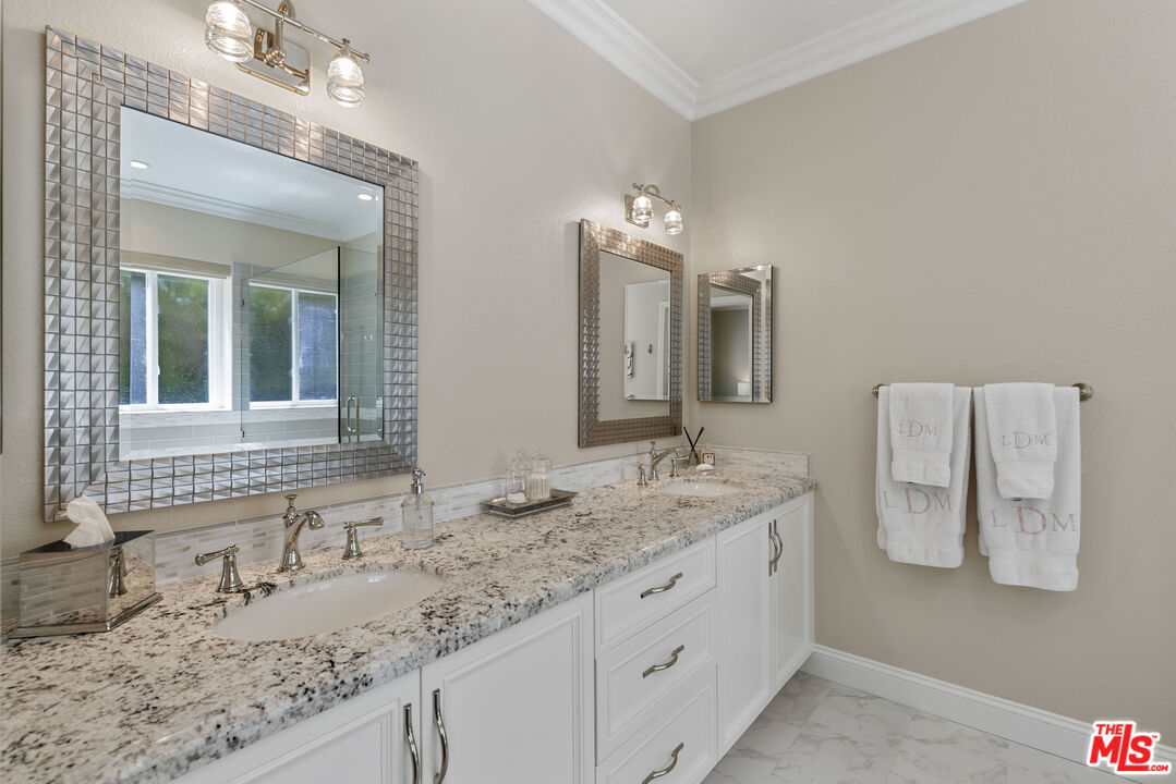 38 Inverness Road Thousand Oaks, CA 91361 - Photo 31 of 42 a bathroom with a granite countertop double vanity sink and a mirror