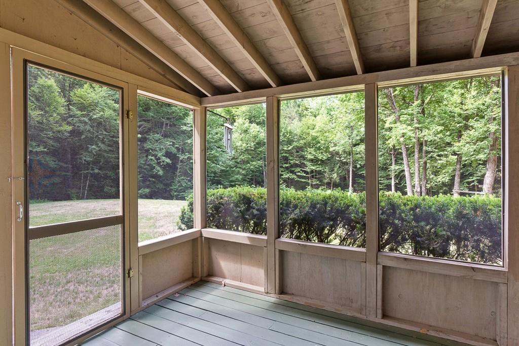 94 Wheeler Road Princeton, MA 01541 - Photo 6 of 40 a view of a room with wooden floor and outdoor view