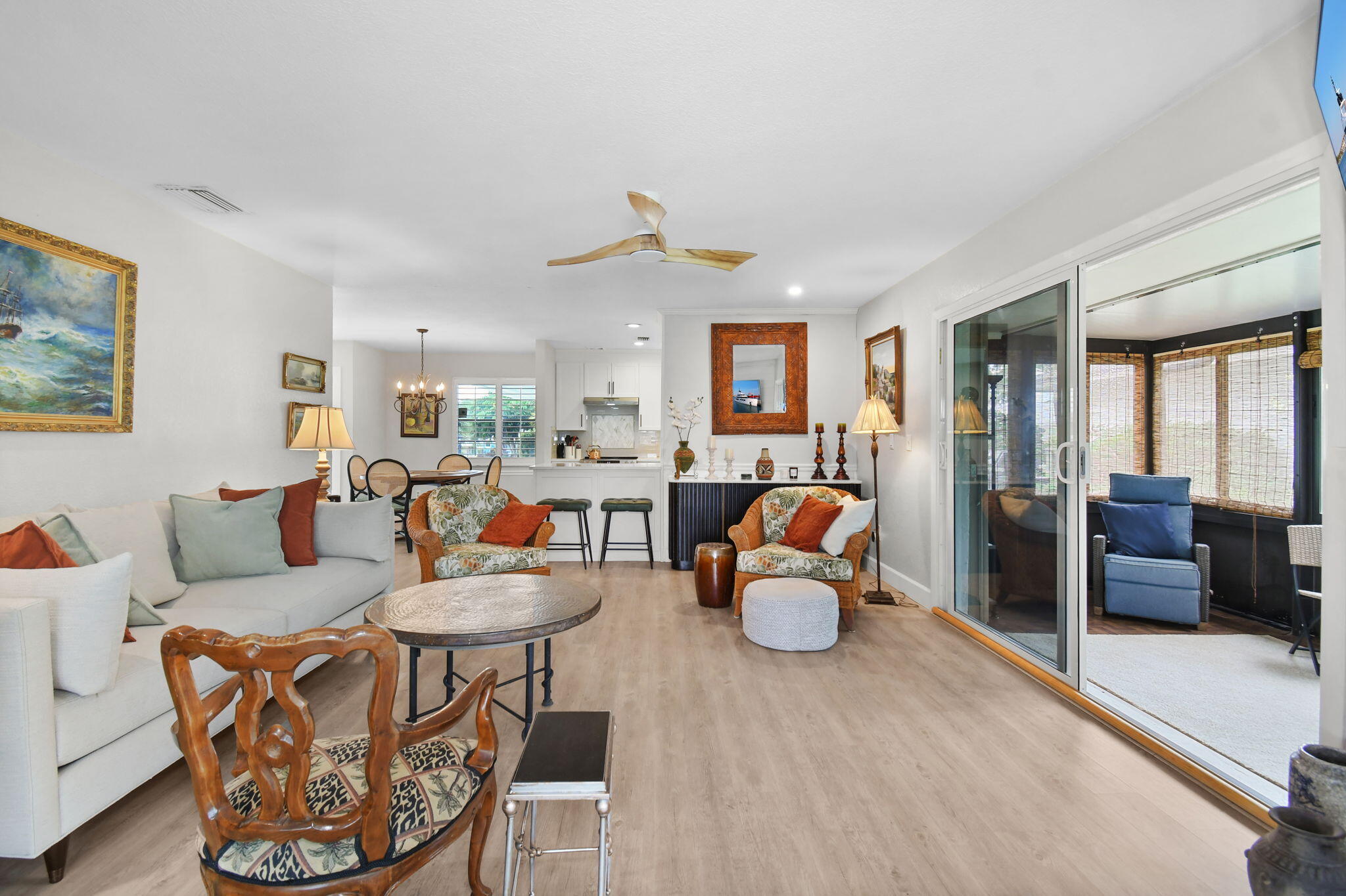 5251 Southeast Sea Island Way Stuart, FL 34997 - Photo 17 of 68 a living room with furniture and a chandelier