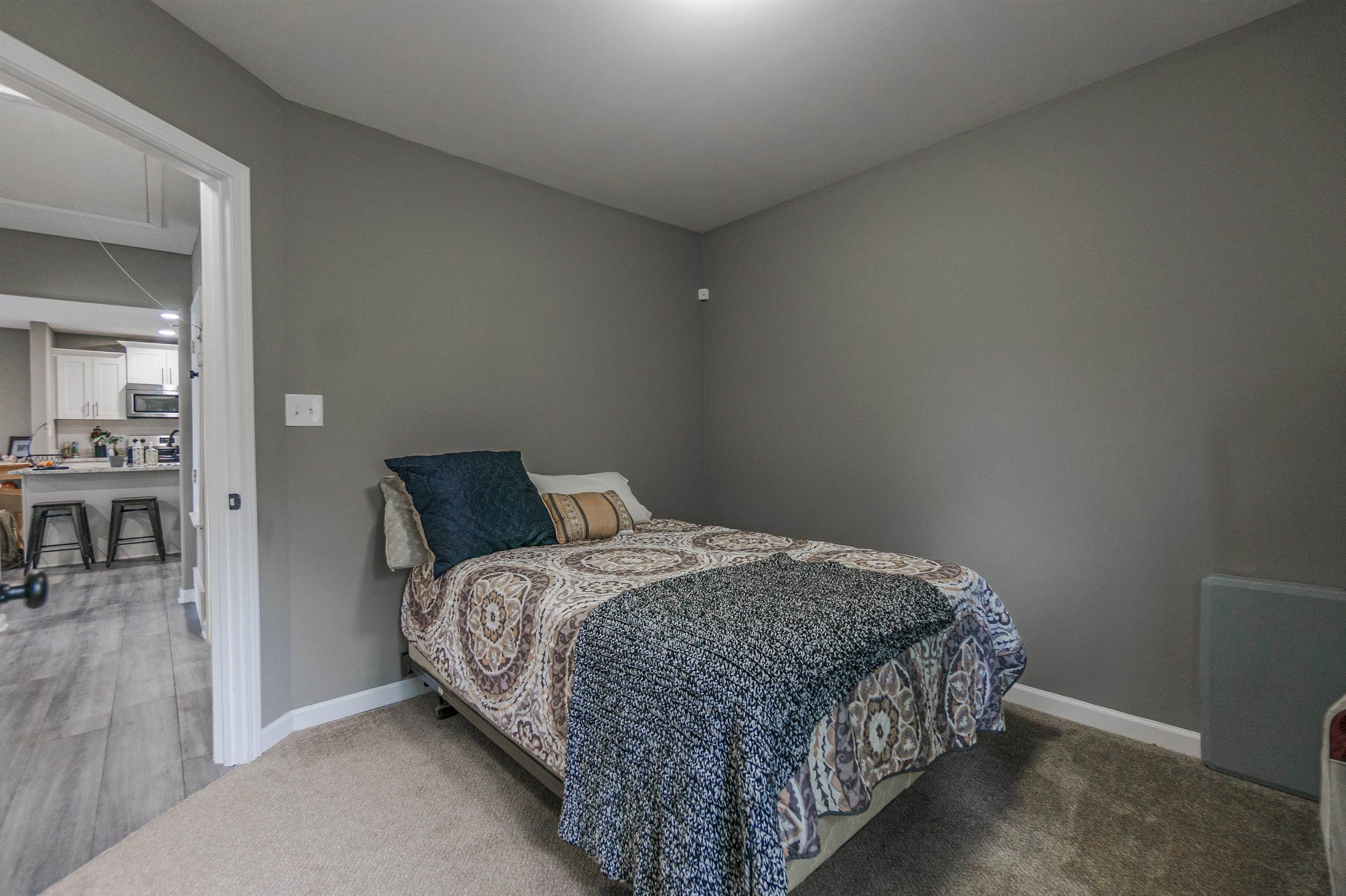 3718 Vanuys Road Memphis, TN 38111 - Photo 15 of 20 a bedroom with a bed and a table in it