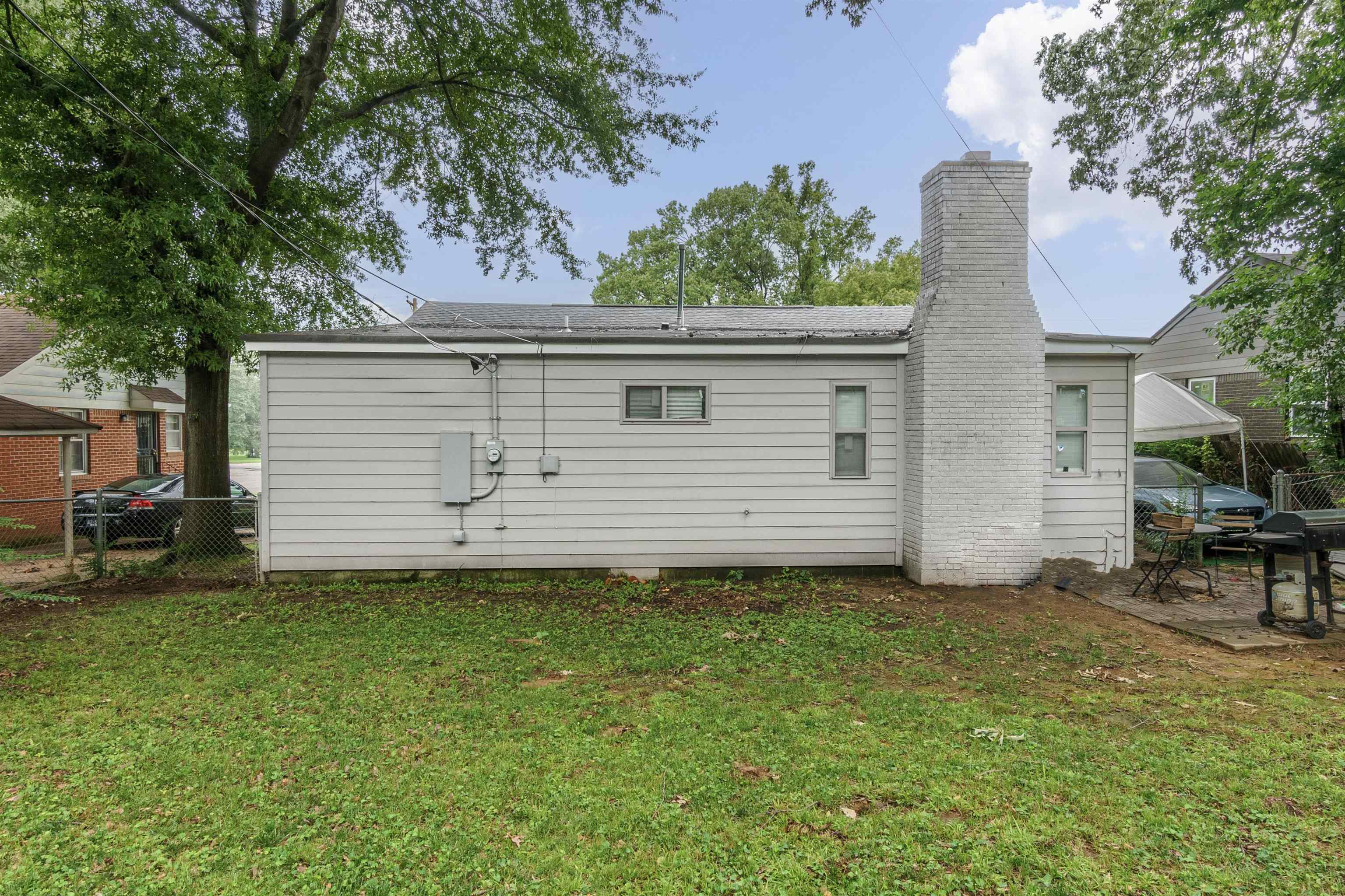3718 Vanuys Road Memphis, TN 38111 - Photo 3 of 20 a backyard of a house with table and chairs