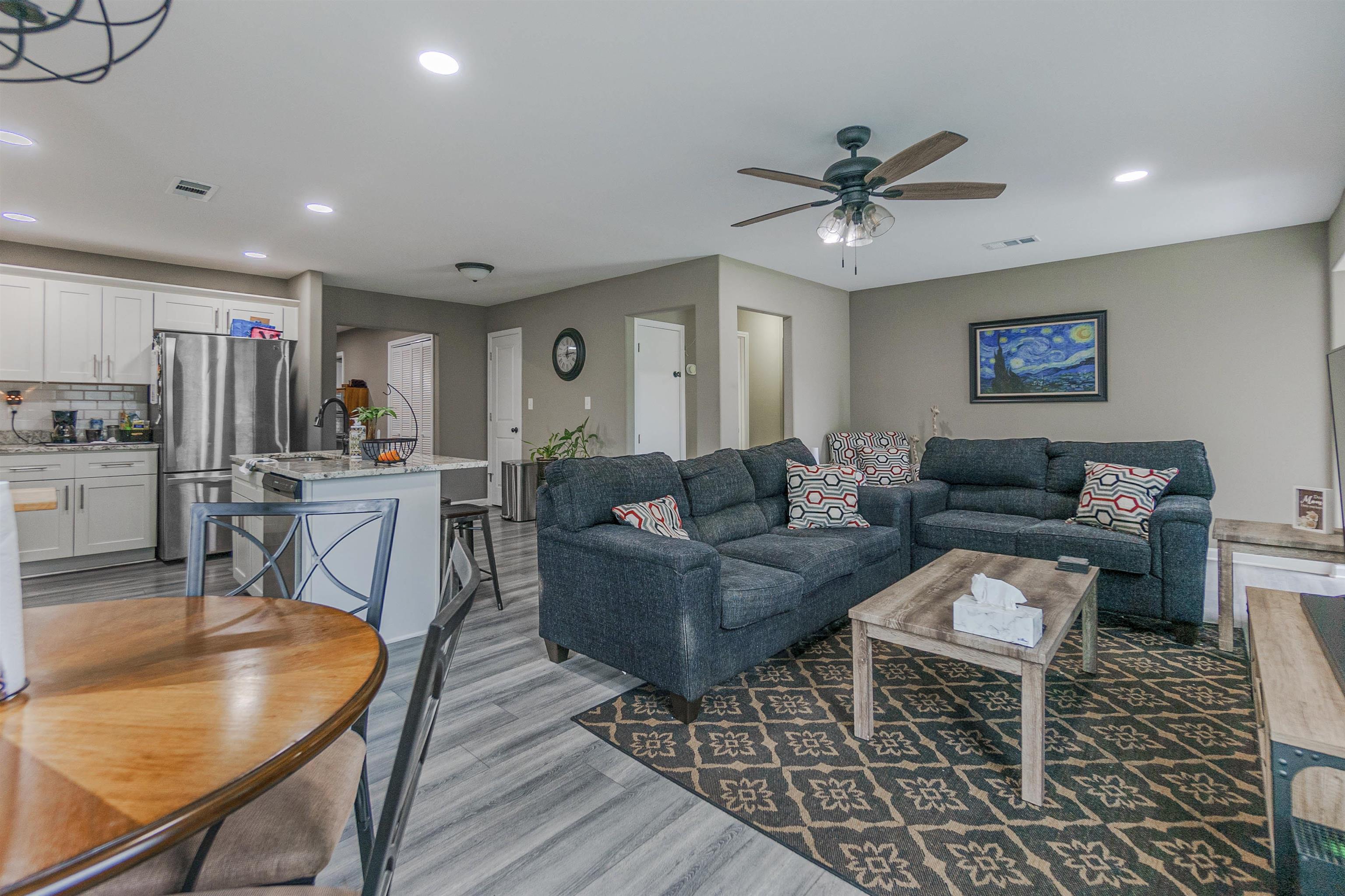 3718 Vanuys Road Memphis, TN 38111 - Photo 5 of 20 a living room with furniture a ceiling fan and a rug