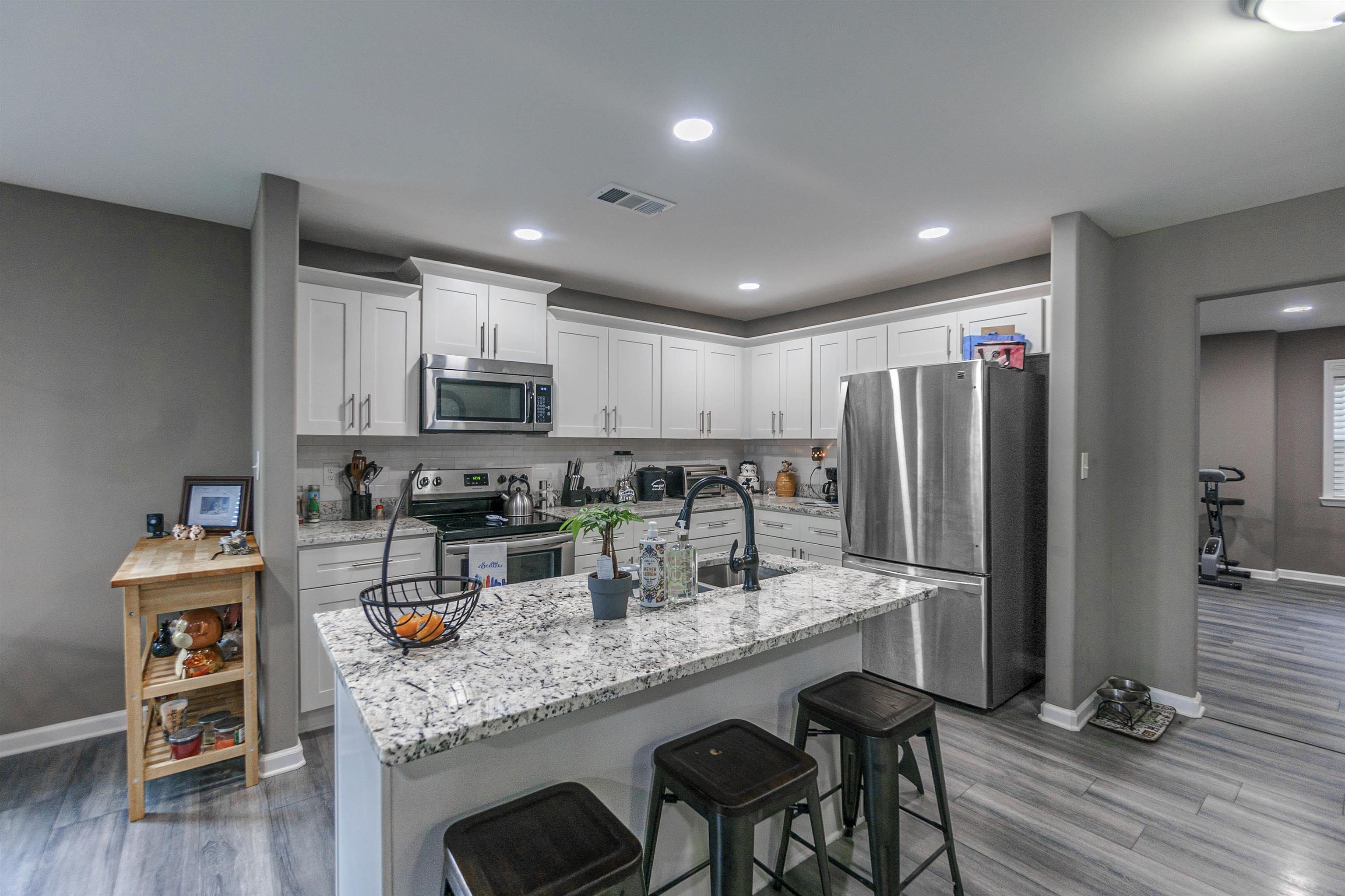 3718 Vanuys Road Memphis, TN 38111 - Photo 6 of 20 a kitchen with stainless steel appliances granite countertop a refrigerator and microwave