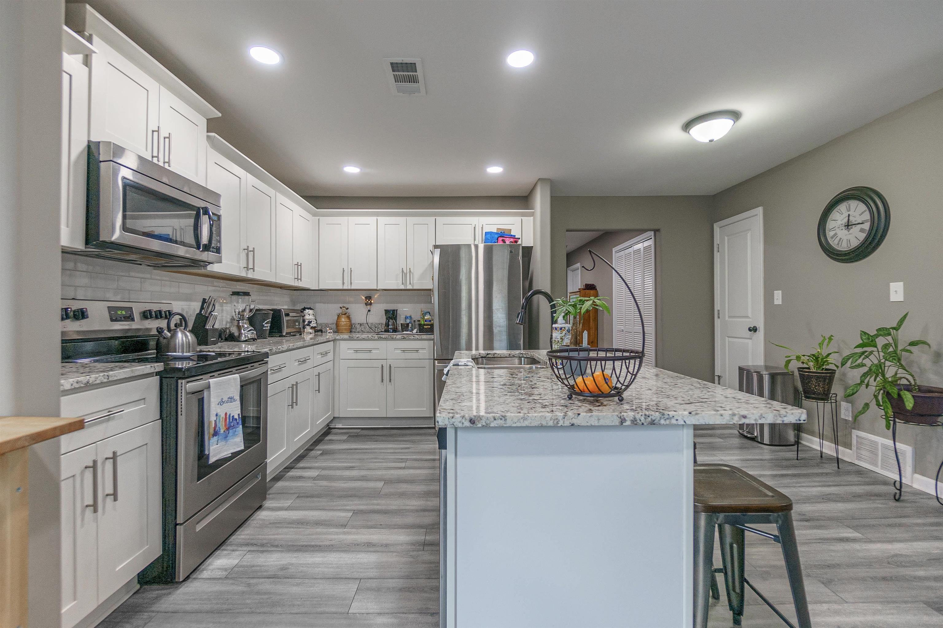 3718 Vanuys Road Memphis, TN 38111 - Photo 9 of 20 a kitchen with stainless steel appliances granite countertop a sink and cabinets