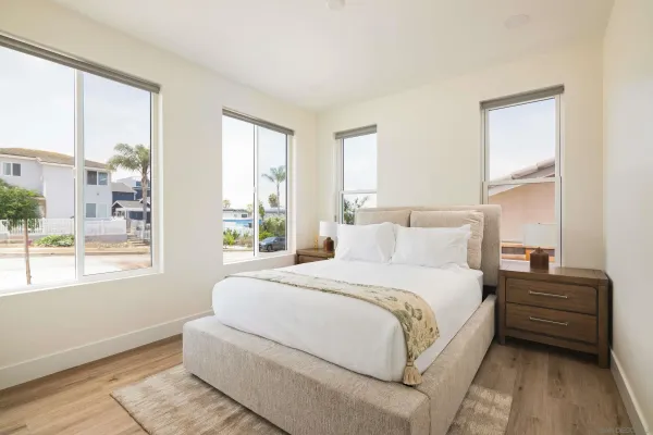 a bedroom with a bed and hallway