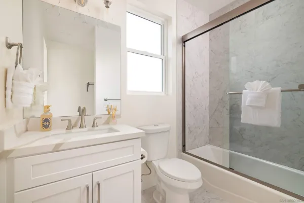 a view of a hallway with washer and dryer