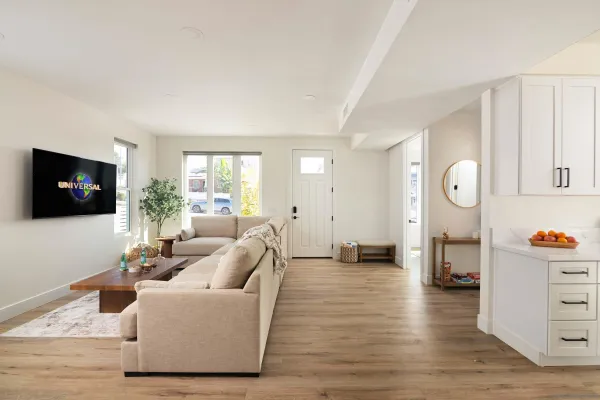 a kitchen with a table and a chair
