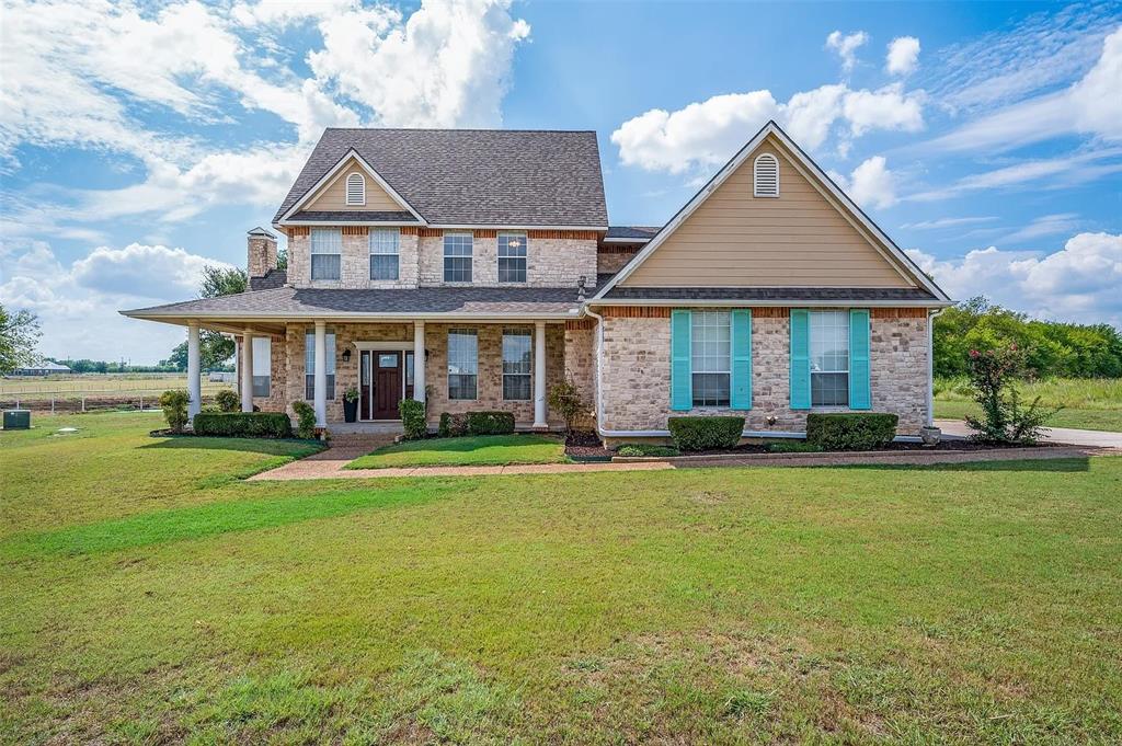 10200 Zipper Road Pilot Point, TX 76258 - Photo 1 of 18 a front view of a house with a yard