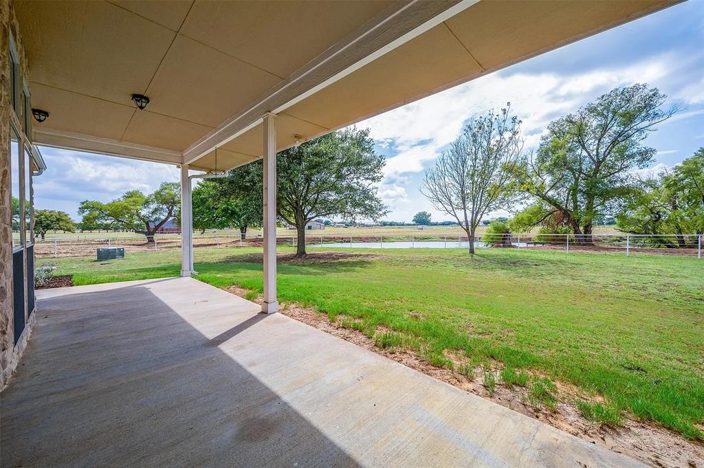 10200 Zipper Road Pilot Point, TX 76258 - Photo 12 of 18 a view of a house with a big yard