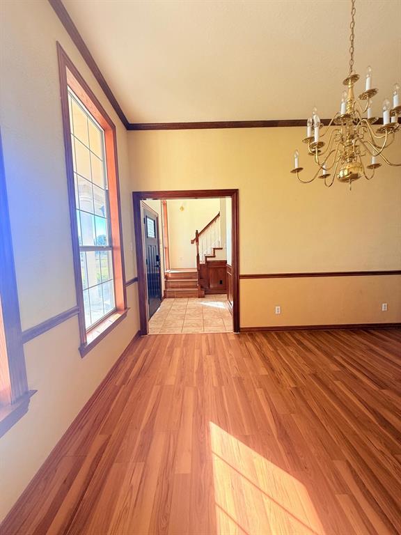 10200 Zipper Road Pilot Point, TX 76258 - Photo 15 of 18 a view of a room with wooden floor and iron stairs