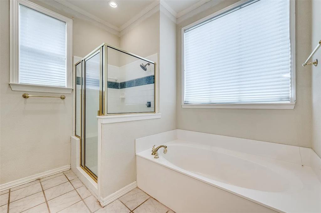 10200 Zipper Road Pilot Point, TX 76258 - Photo 9 of 18 a bathroom with a bathtub and a shower