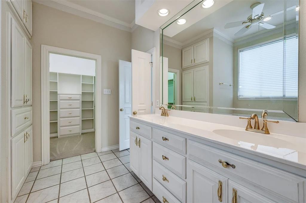 10200 Zipper Road Pilot Point, TX 76258 - Photo 10 of 18 a spacious bathroom with a shower a sink and a mirror