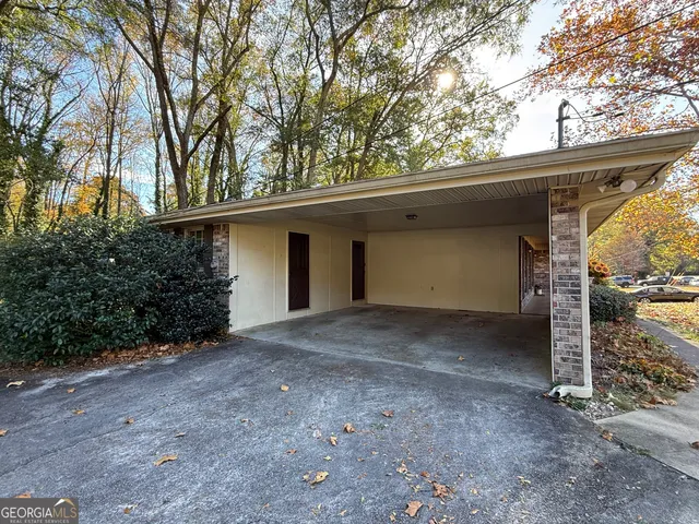 a view of a house with a large tree