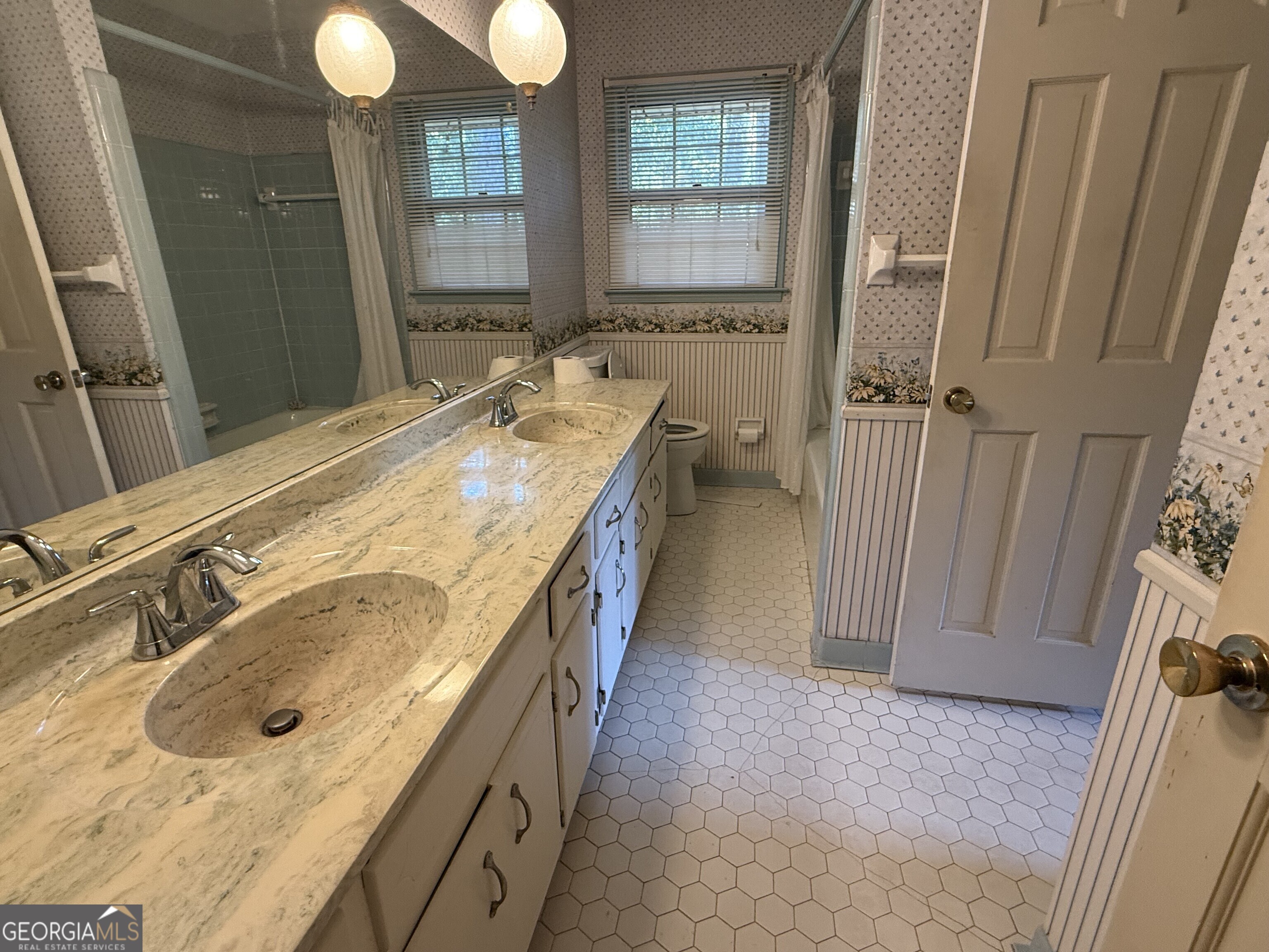 5904 Foxfield Trail Rex, GA 30273 - Photo 9 of 13 a spacious bathroom with a tub sink and mirror
