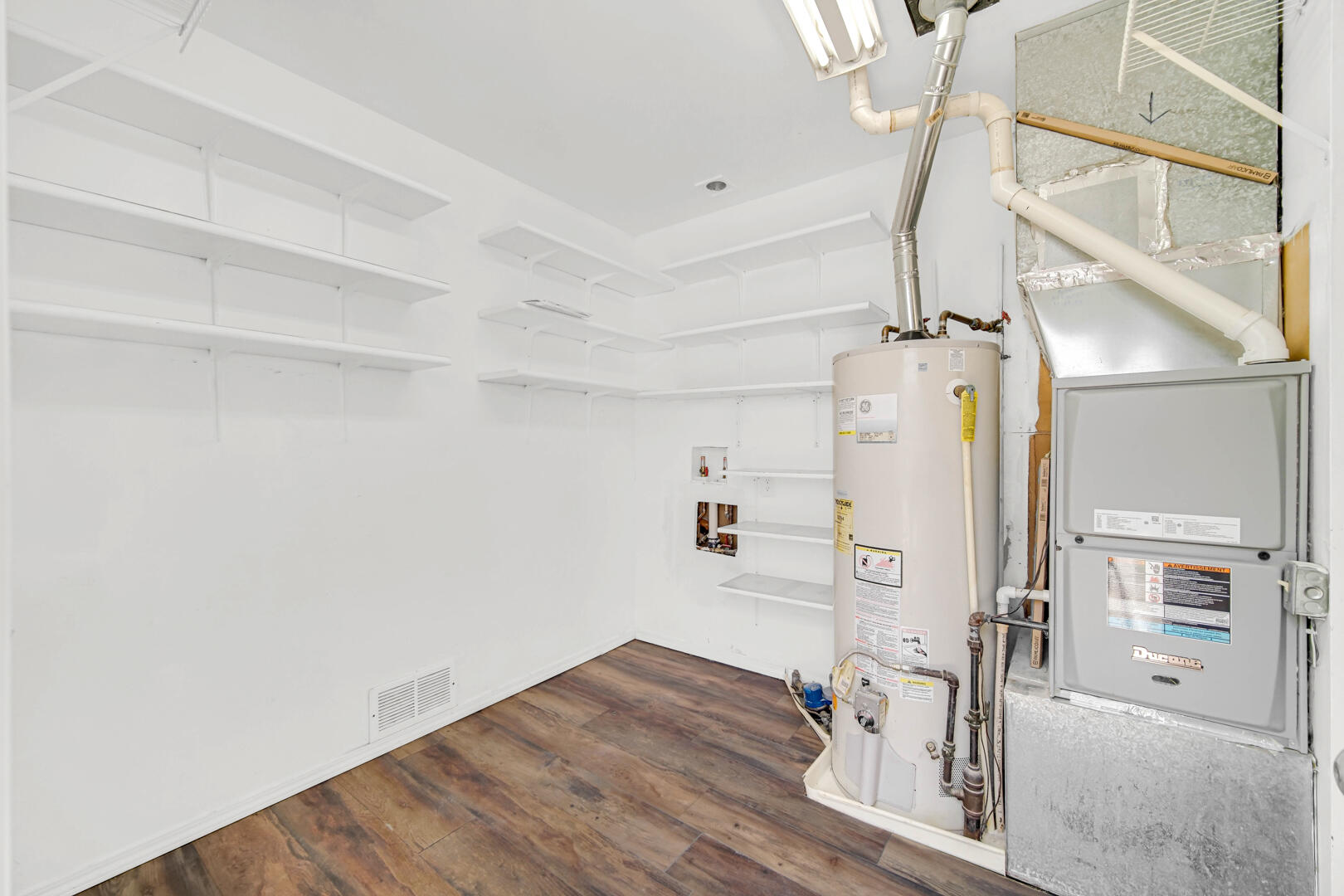 769-1 Juniper Road Valparaiso, IN 46385 - Photo 11 of 20 a view of a livingroom with wooden floor staircase and a kitchen view